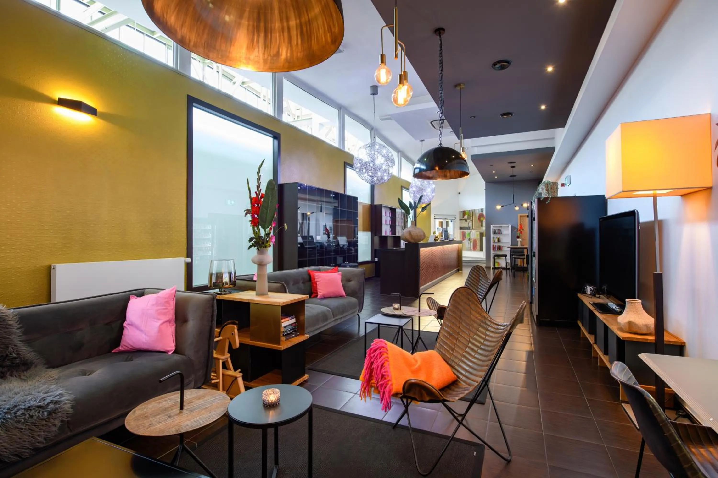 Communal lounge/ TV room in SleepinRoomz Boutique Hotel