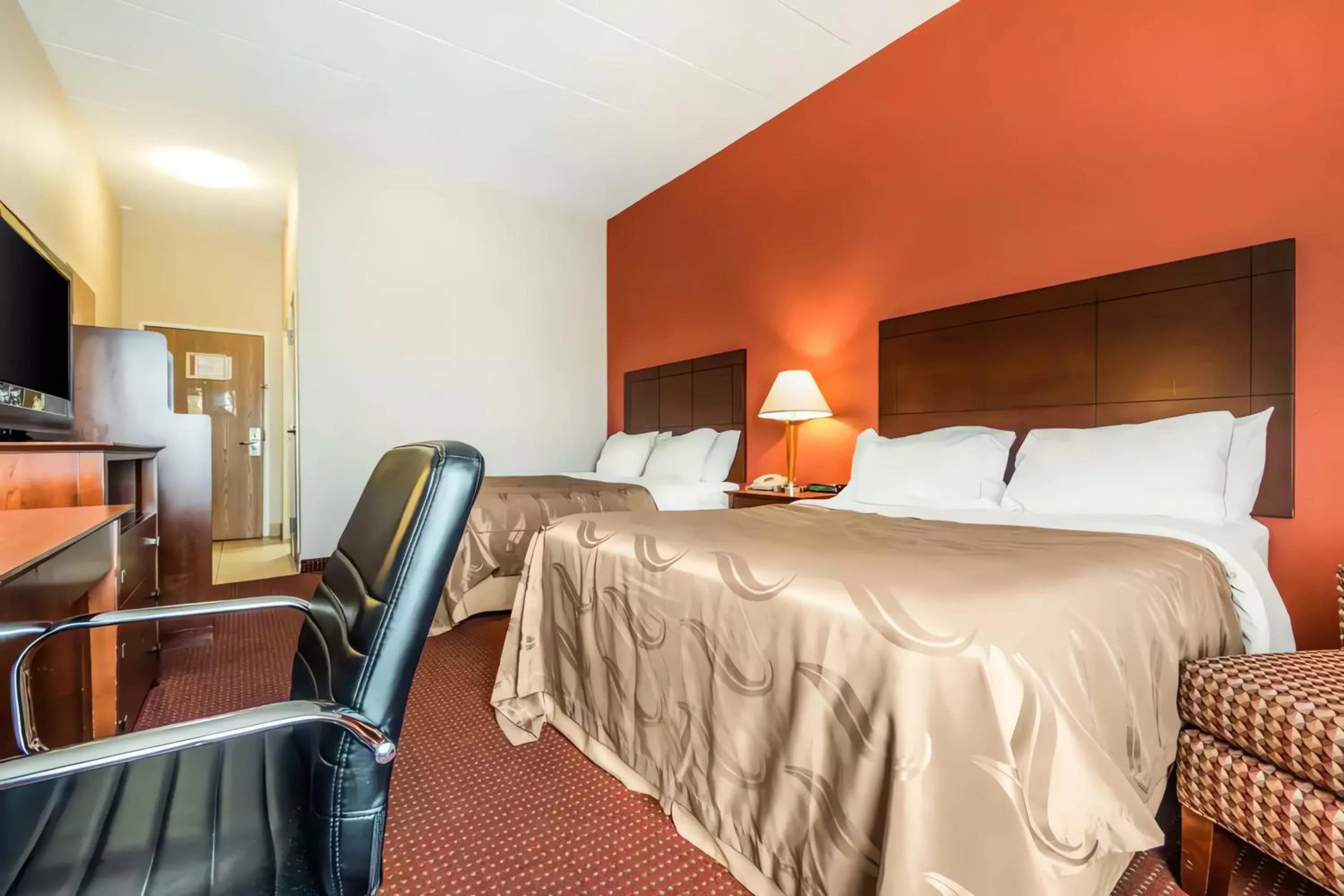 Bed in Quality Inn & Suites Lawrenceburg