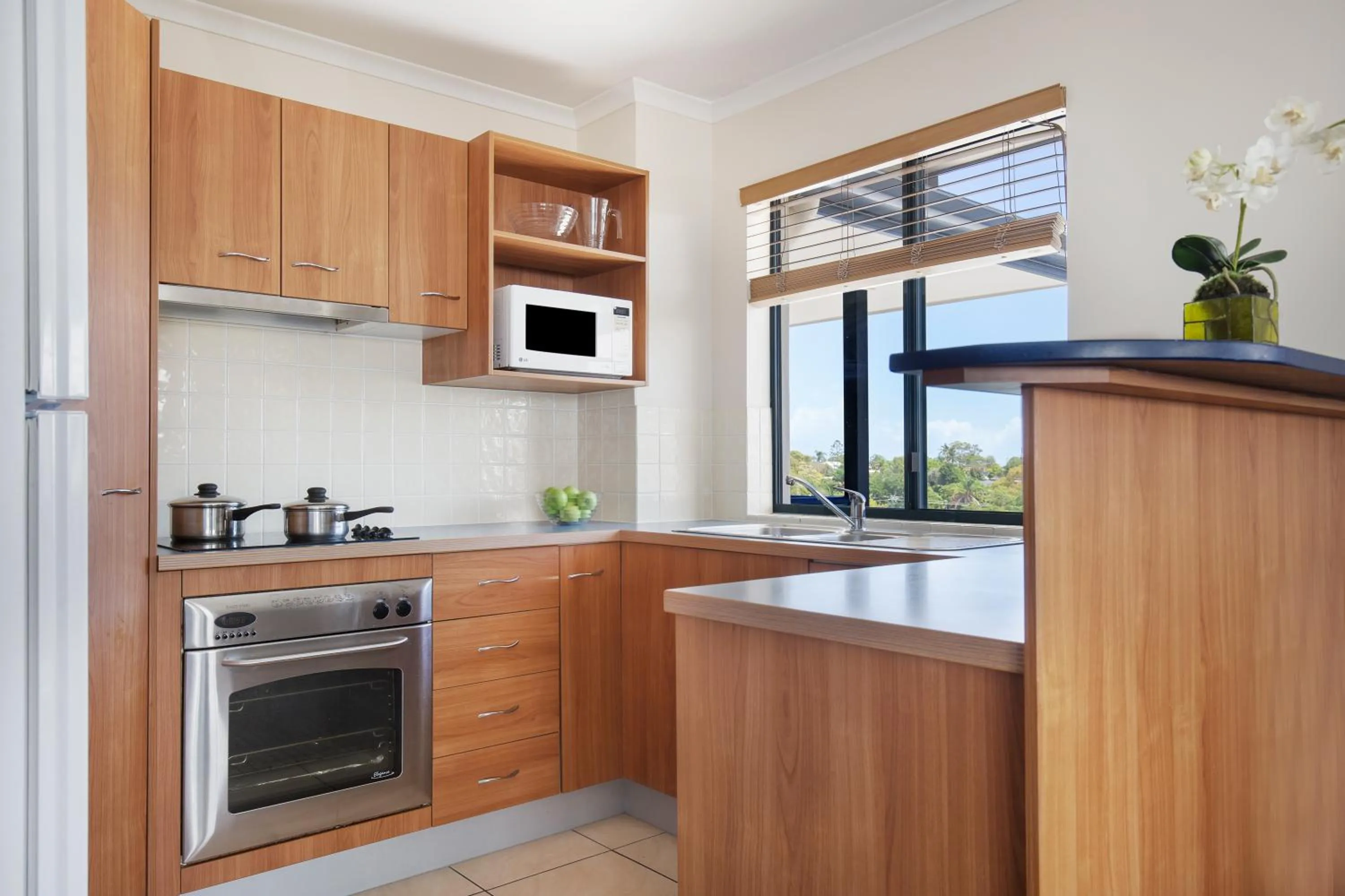 Kitchen or kitchenette in Mantra Hervey Bay