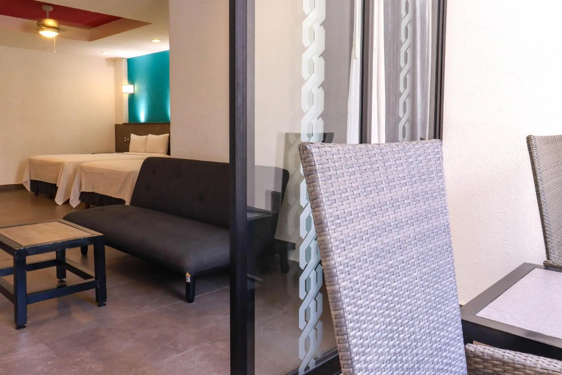 Seating area, Bed in Hotel MX portal maya