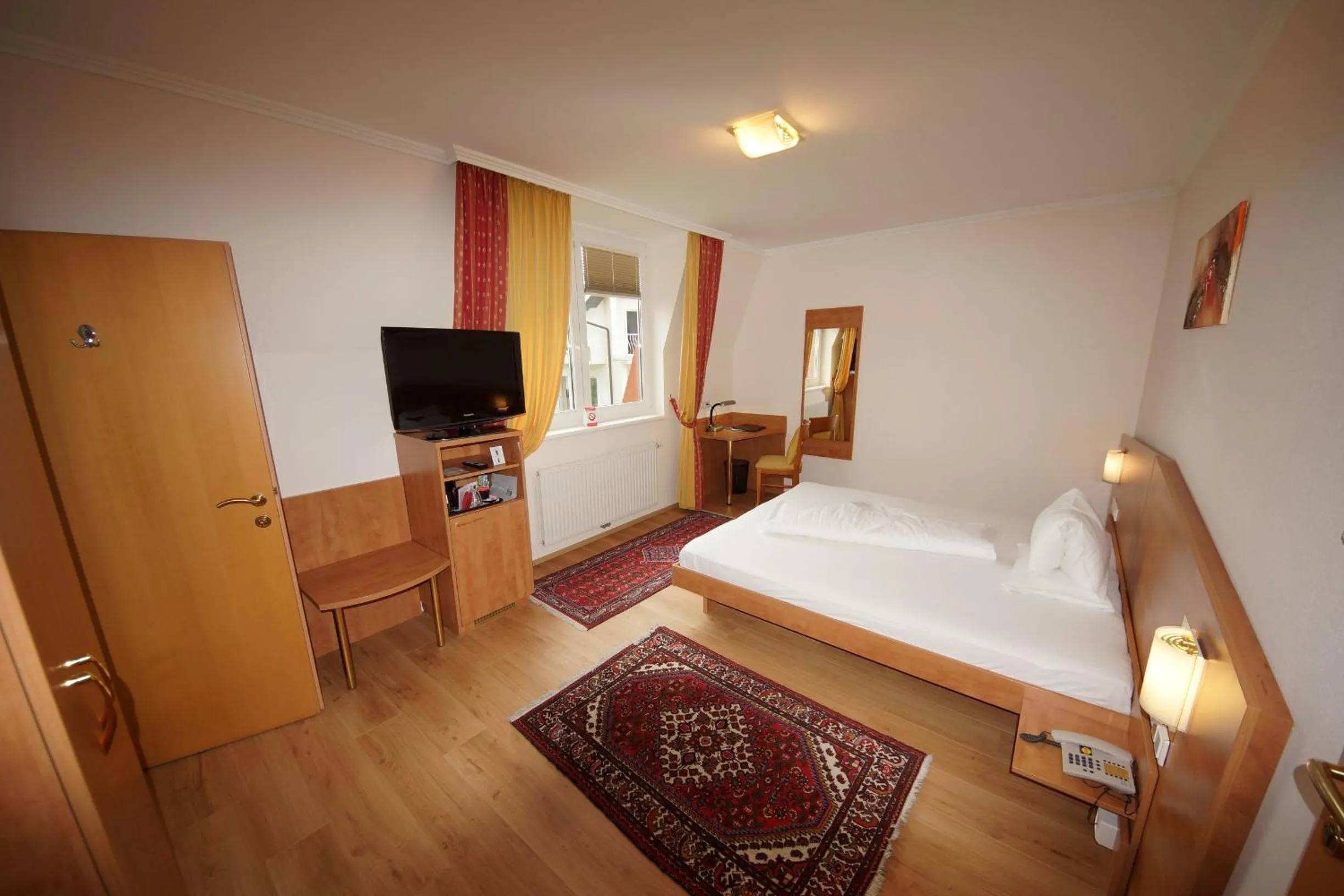 Photo of the whole room, Bed in Der Marienhof Hotel Garni