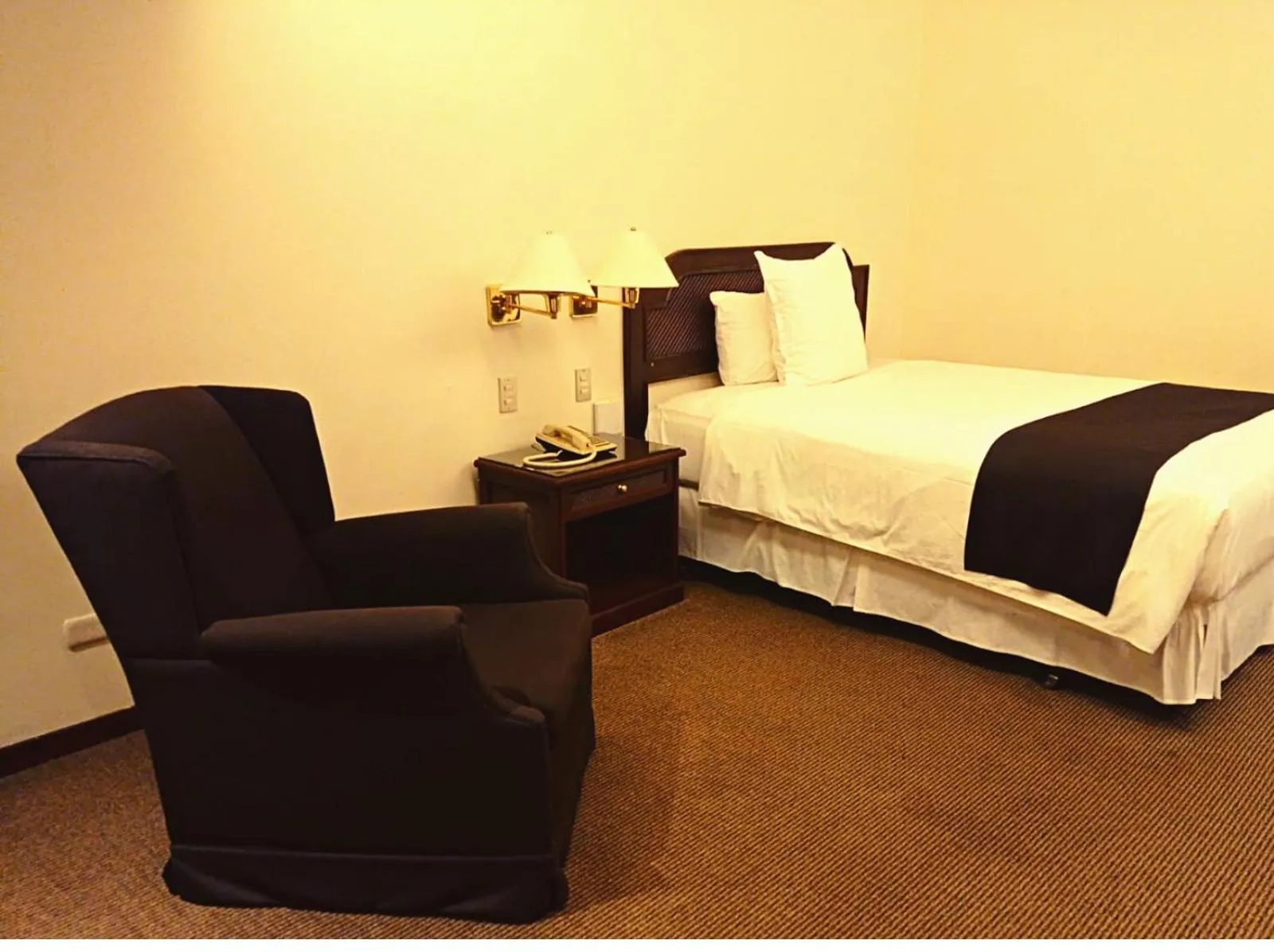 Bed in J&A Classic Hotel