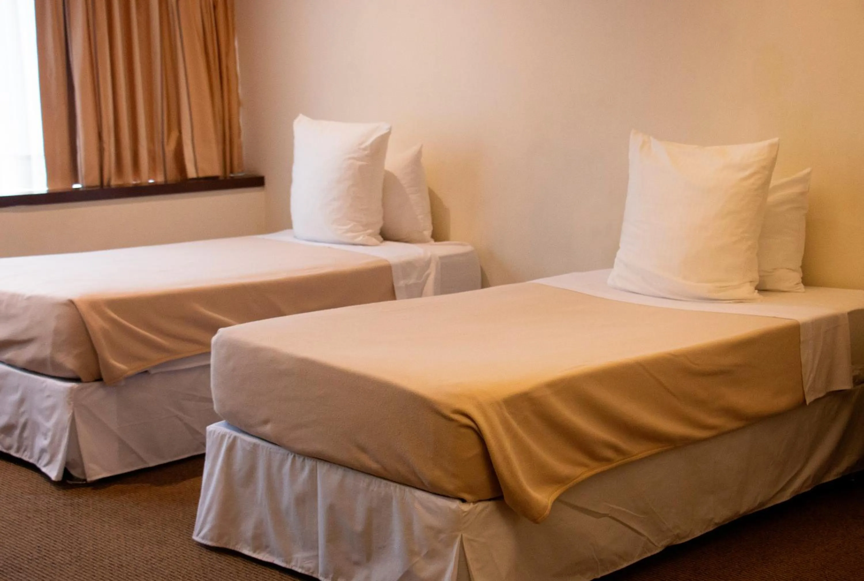 Bed in J&A Classic Hotel