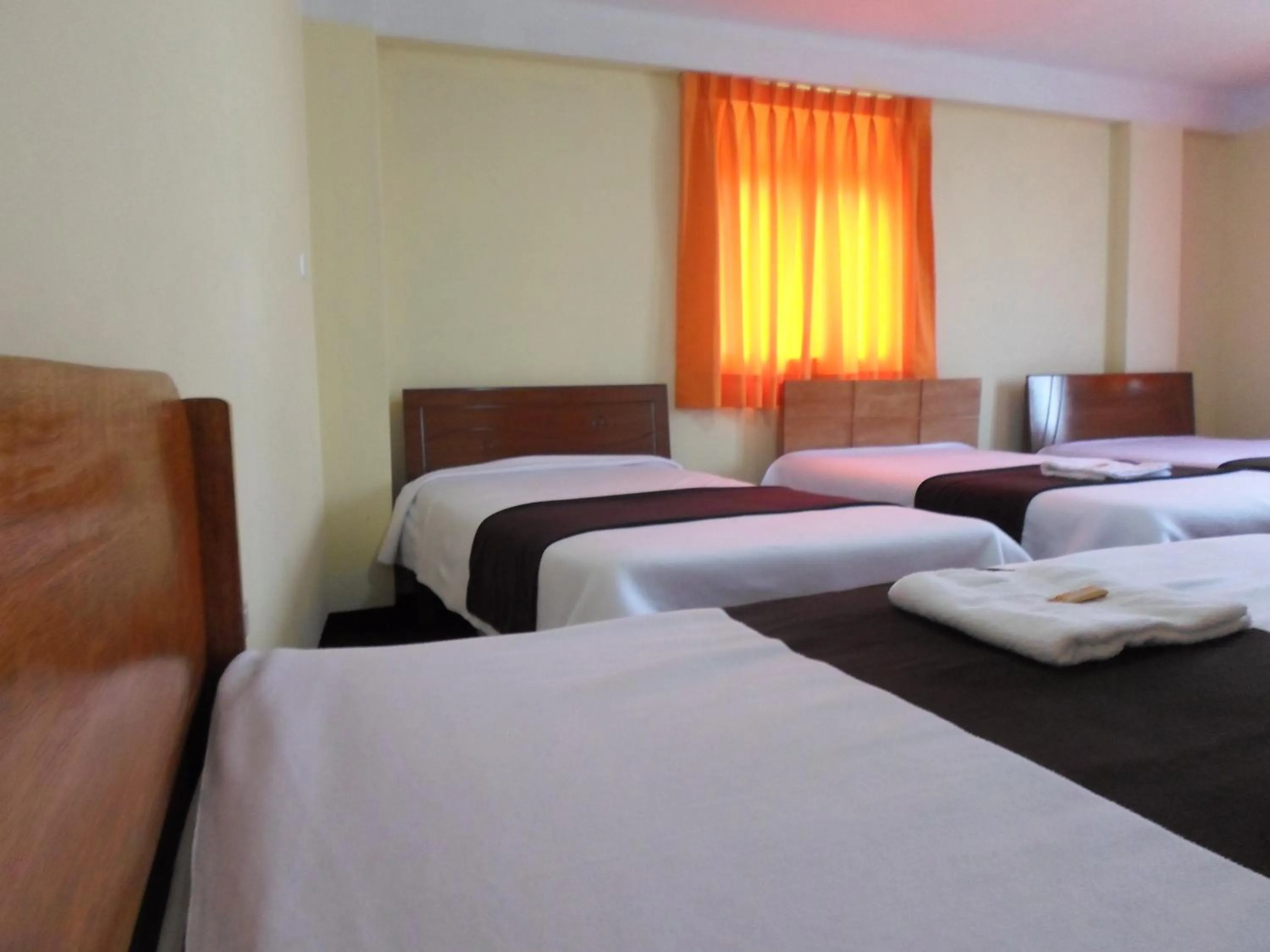 towels, Bed in Hostal Casa del Montañista