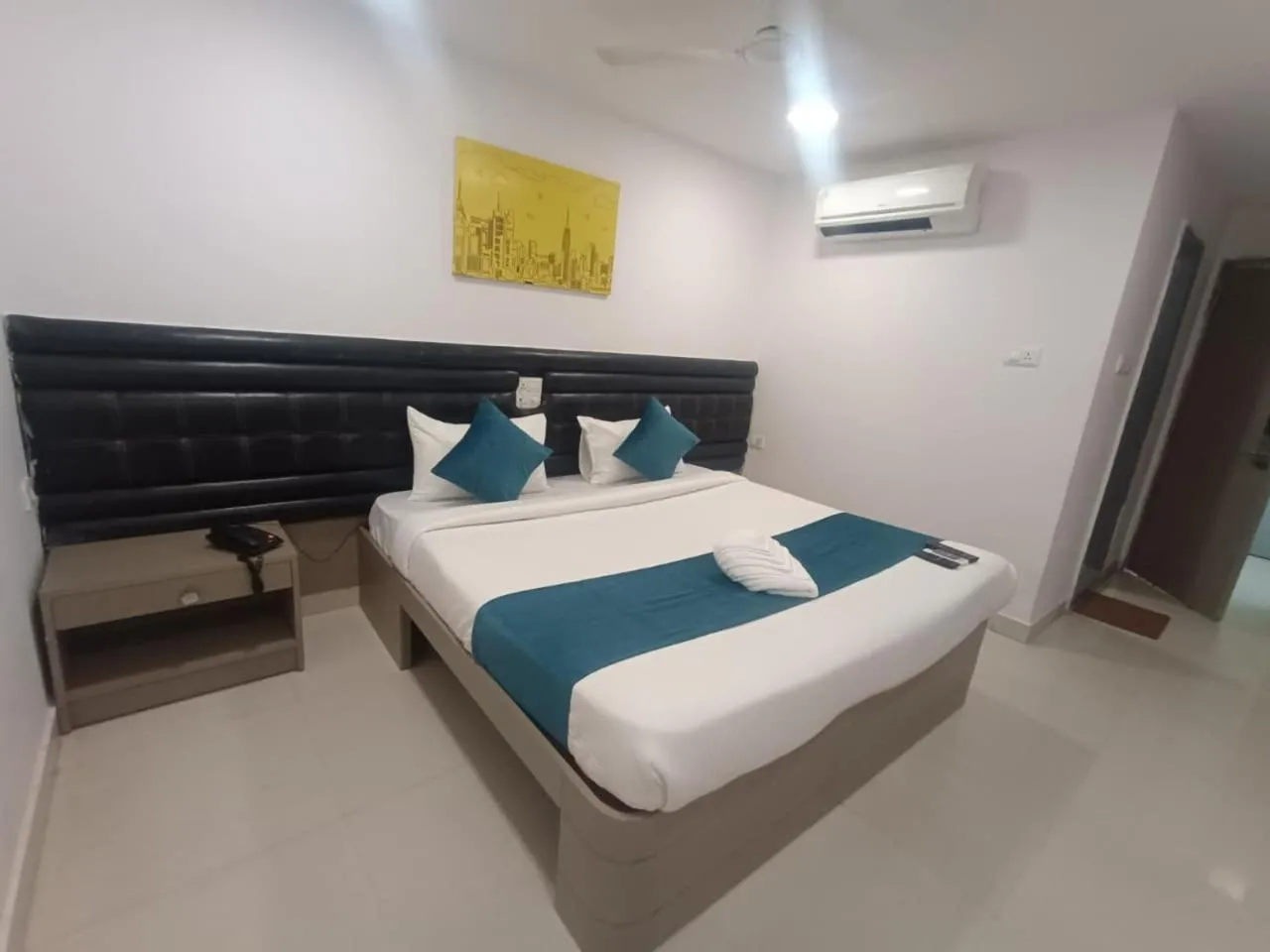 Bed in La Riviera Suites