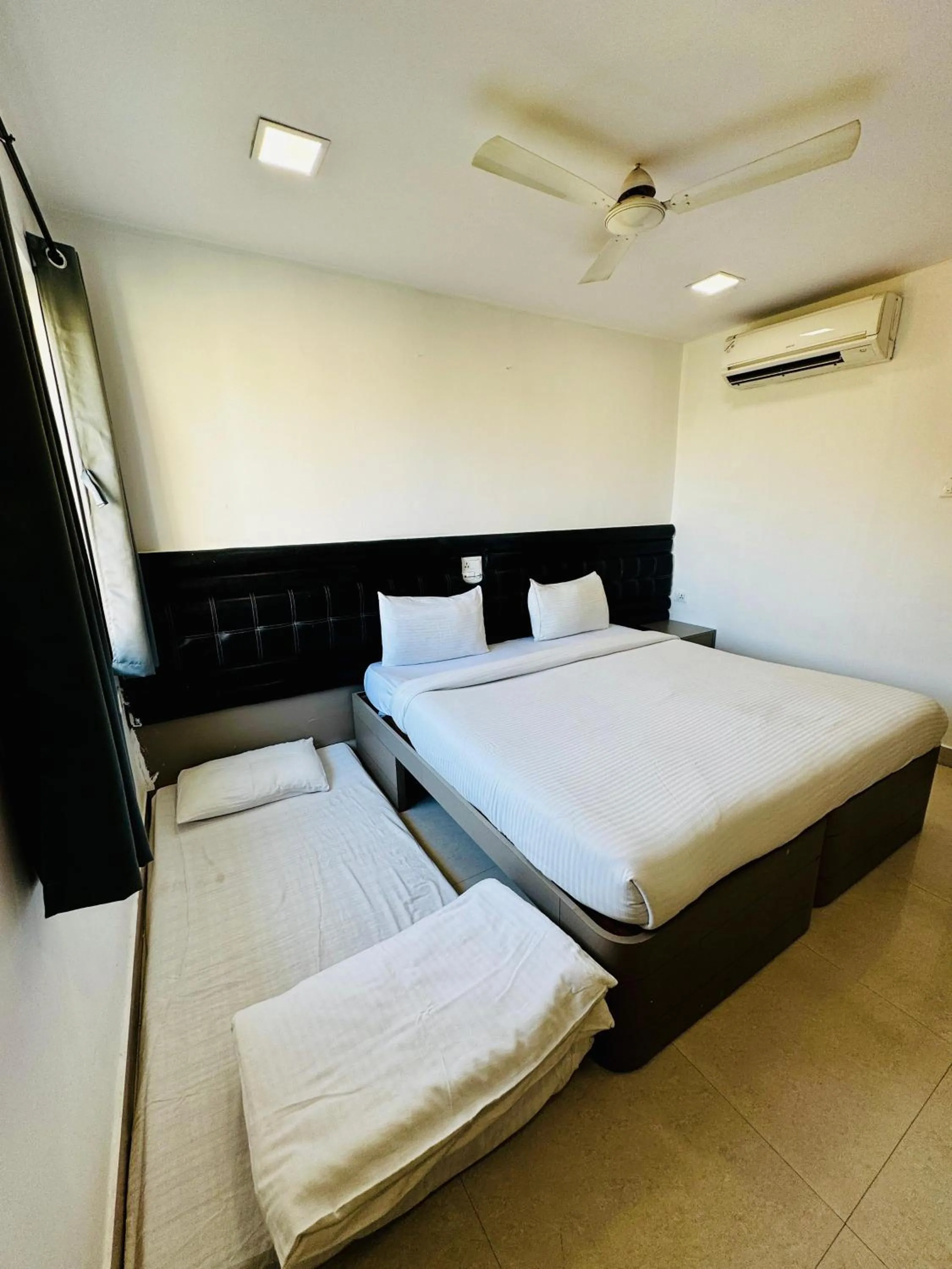Bed in La Riviera Suites