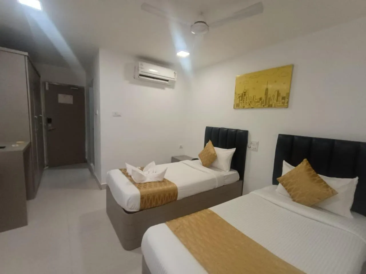 Bed in La Riviera Suites
