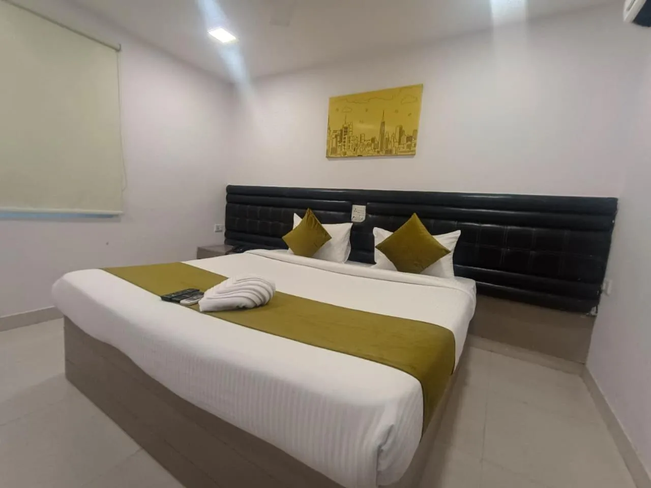 Bed in La Riviera Suites