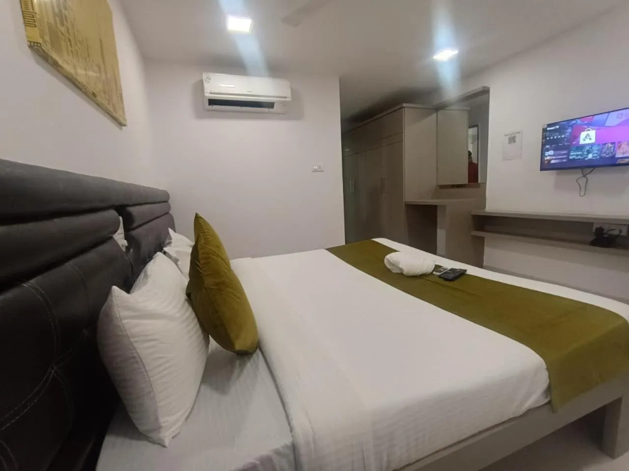 Bed in La Riviera Suites