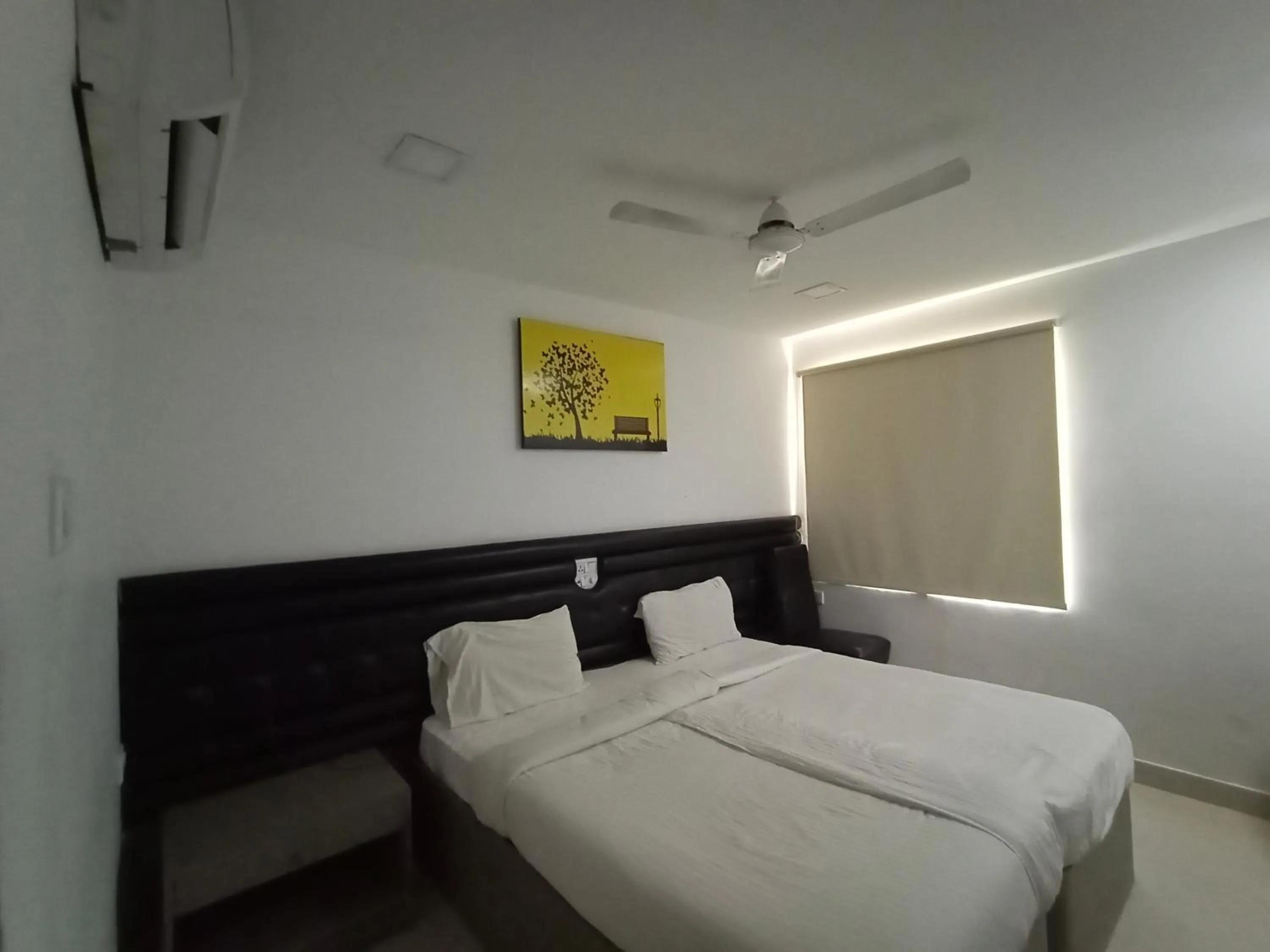 Bed in La Riviera Suites