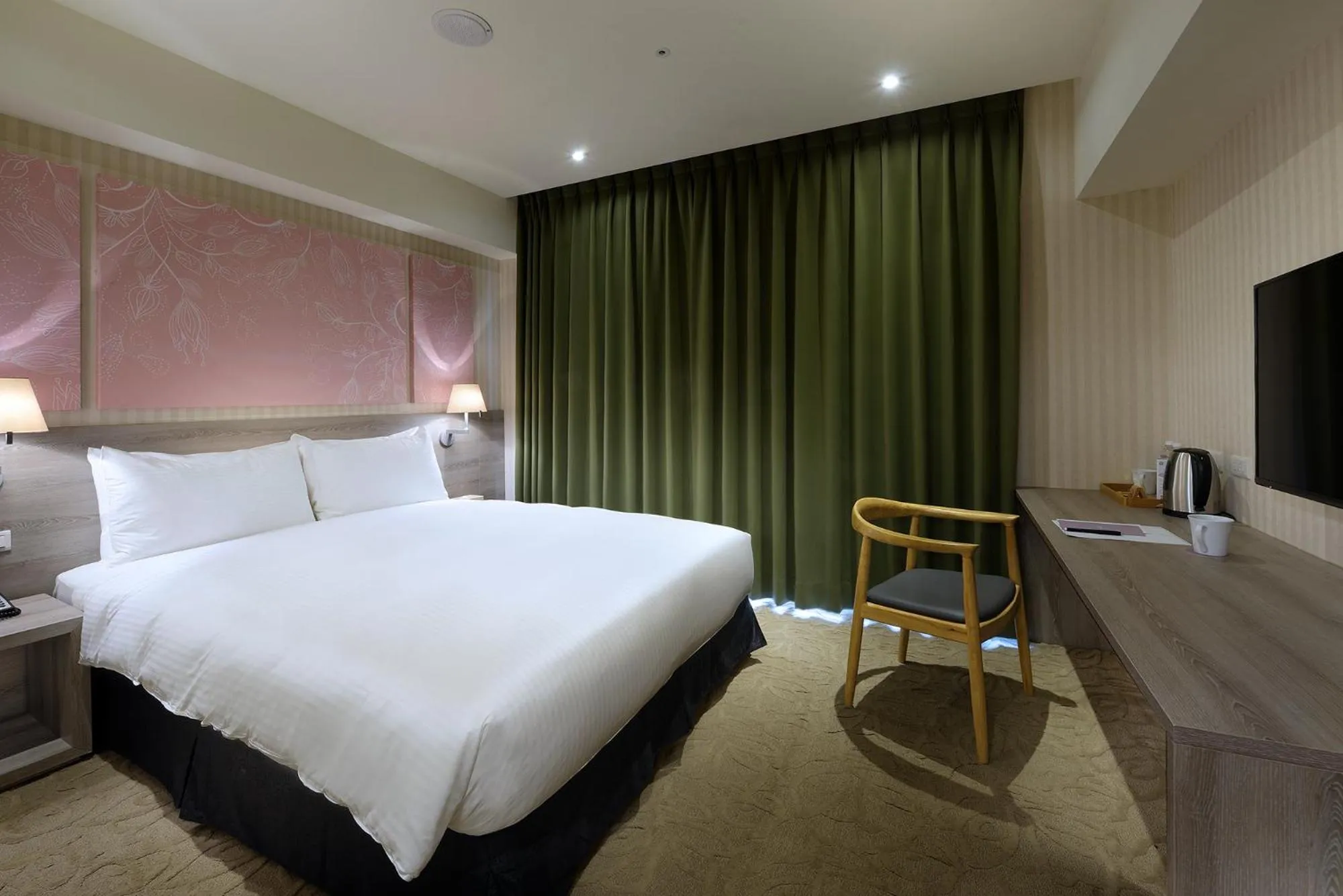 Bed in Aeris International Hotel
