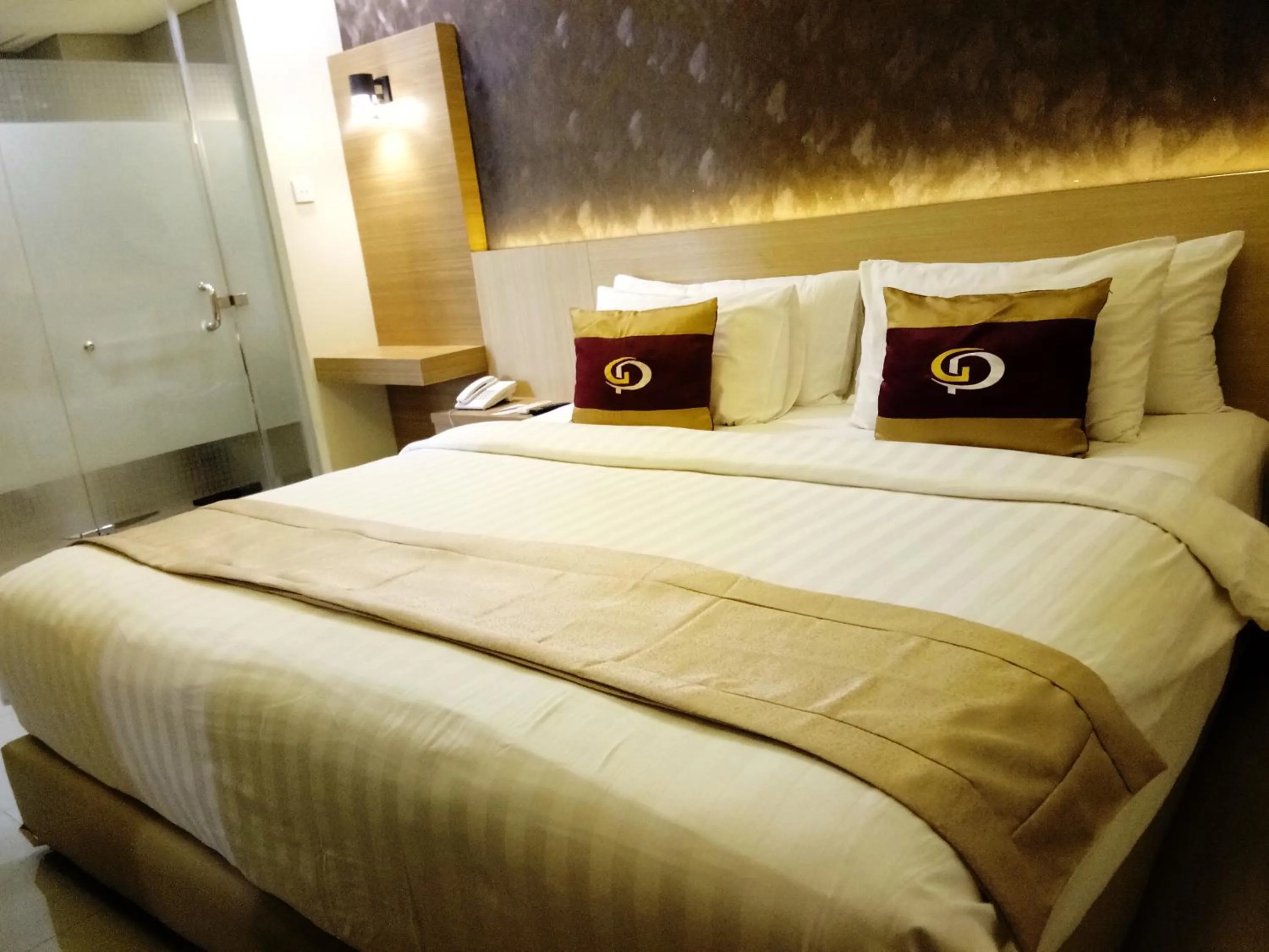 Bed in Grand Parama Hotel