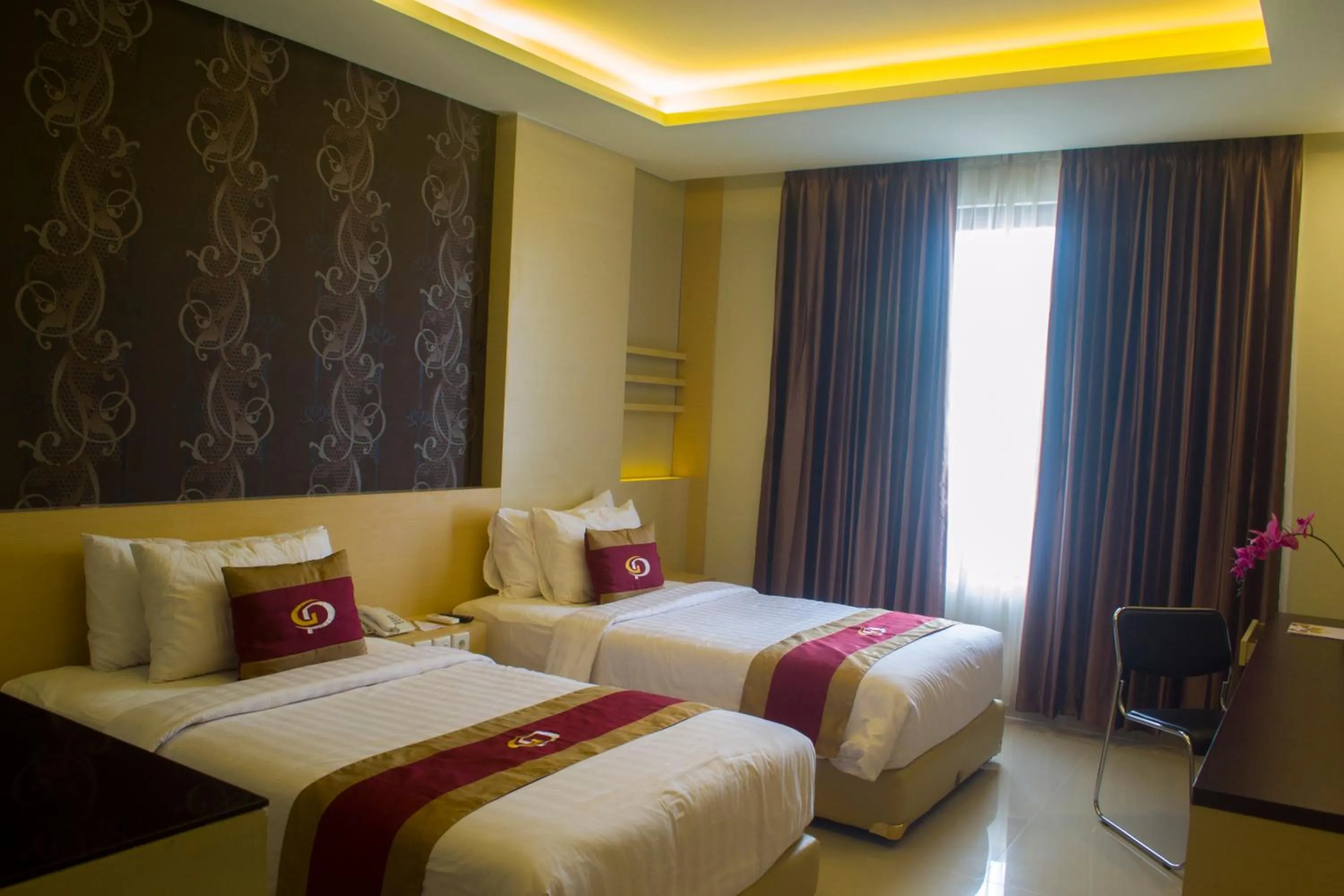 Bed in Grand Parama Hotel