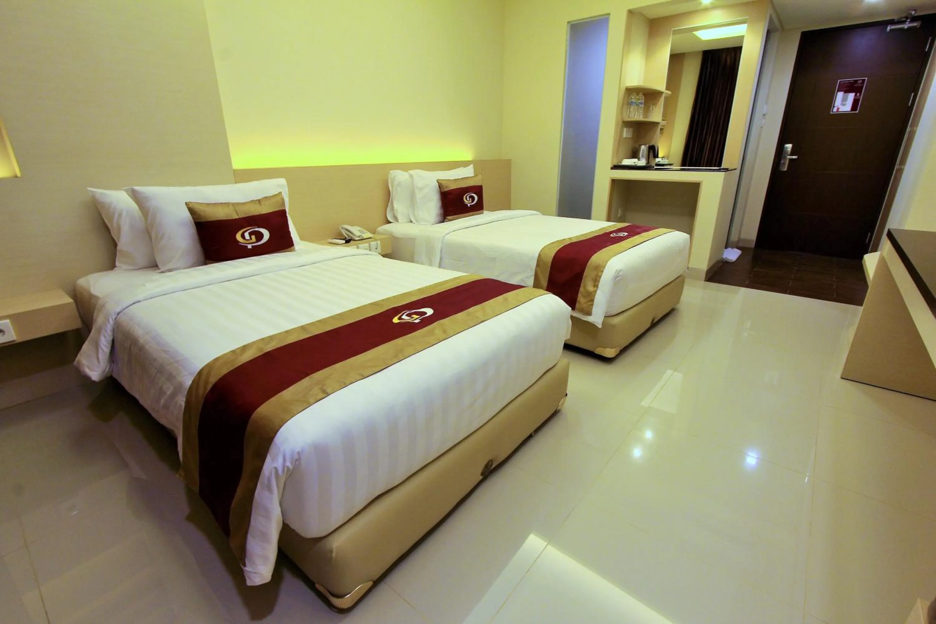 Bed in Grand Parama Hotel