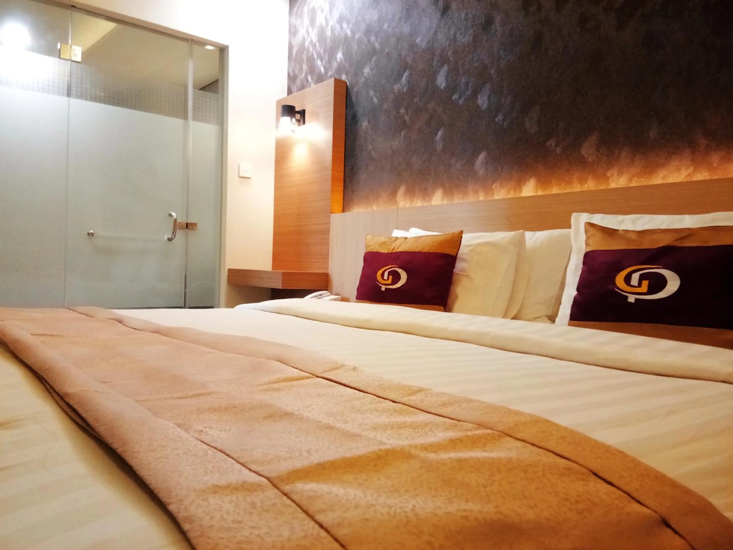 Bed in Grand Parama Hotel