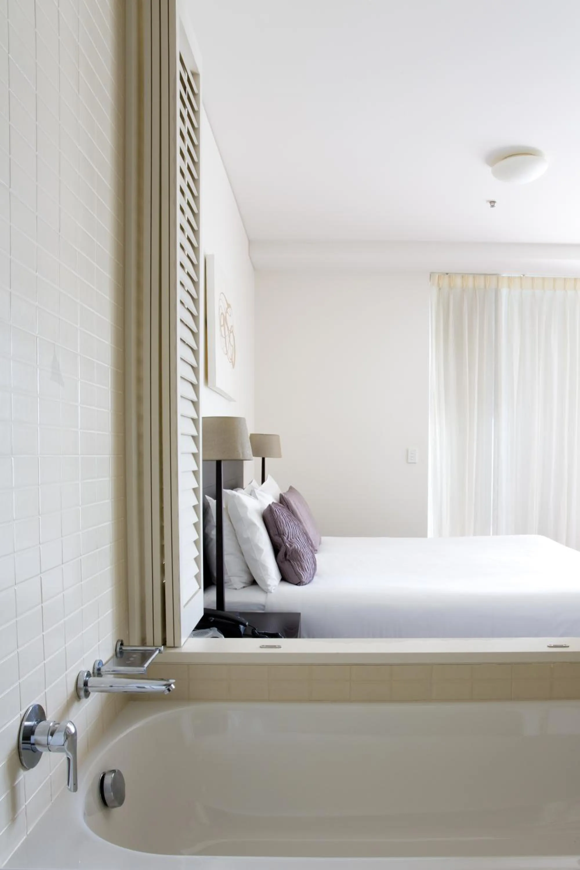 Bed in Cairns Private Apartments