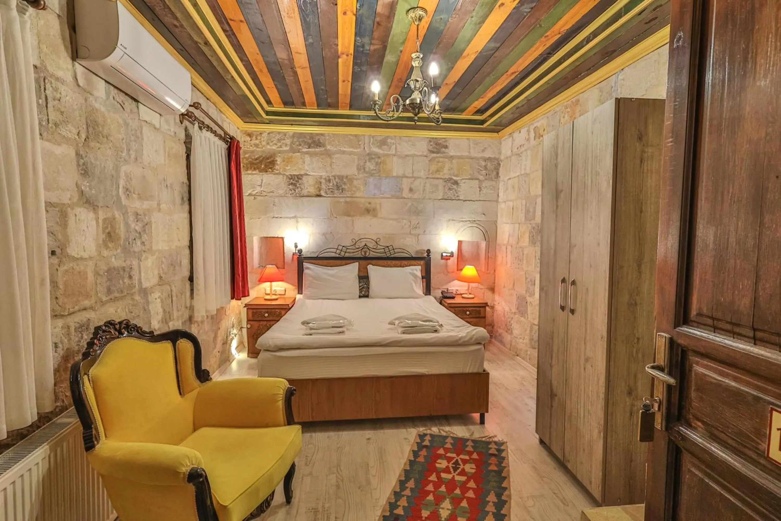 Bed in Bedrock Cave Hotel