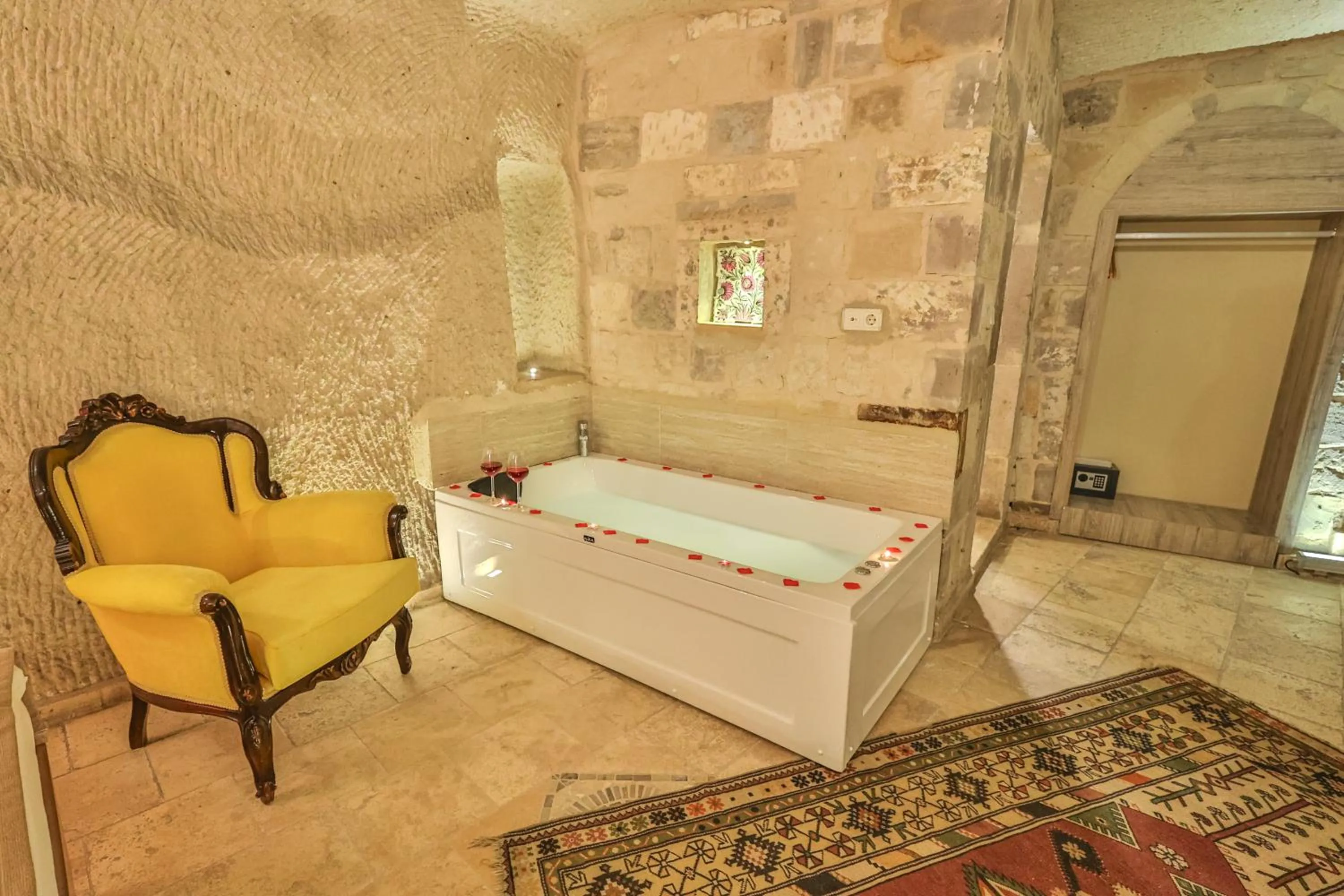 Bed in Bedrock Cave Hotel