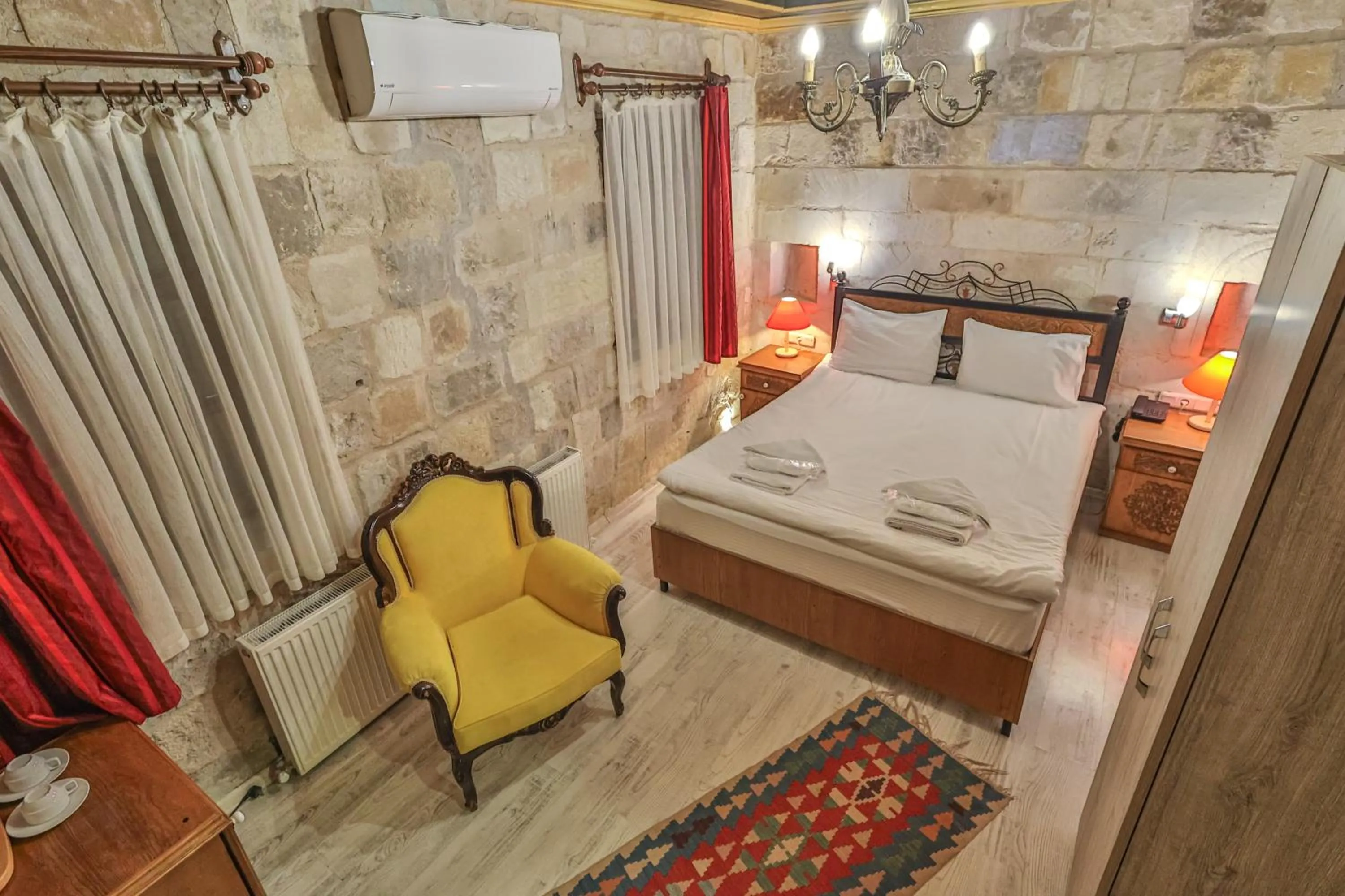 Bed in Bedrock Cave Hotel