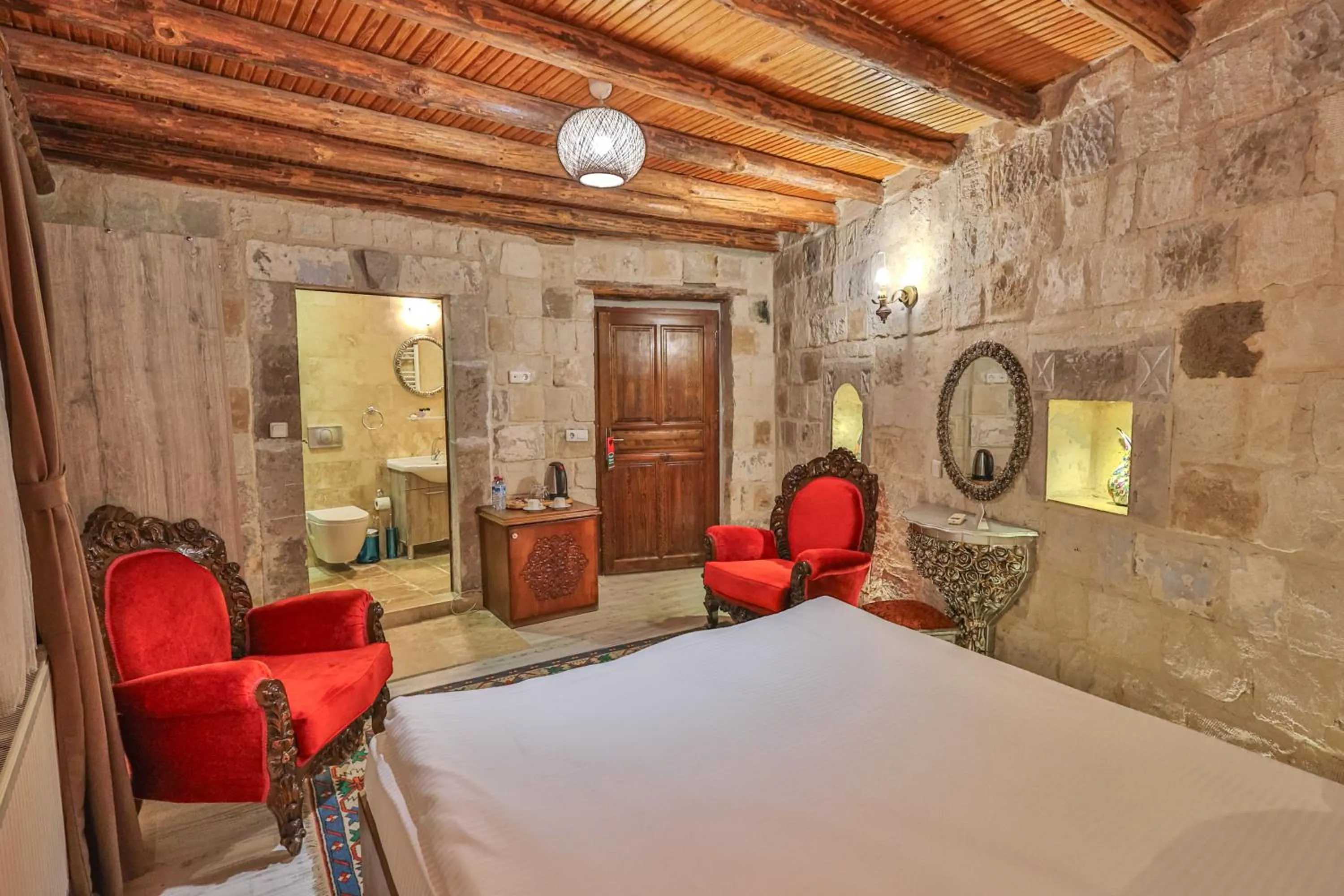 Photo of the whole room, Bed in Bedrock Cave Hotel