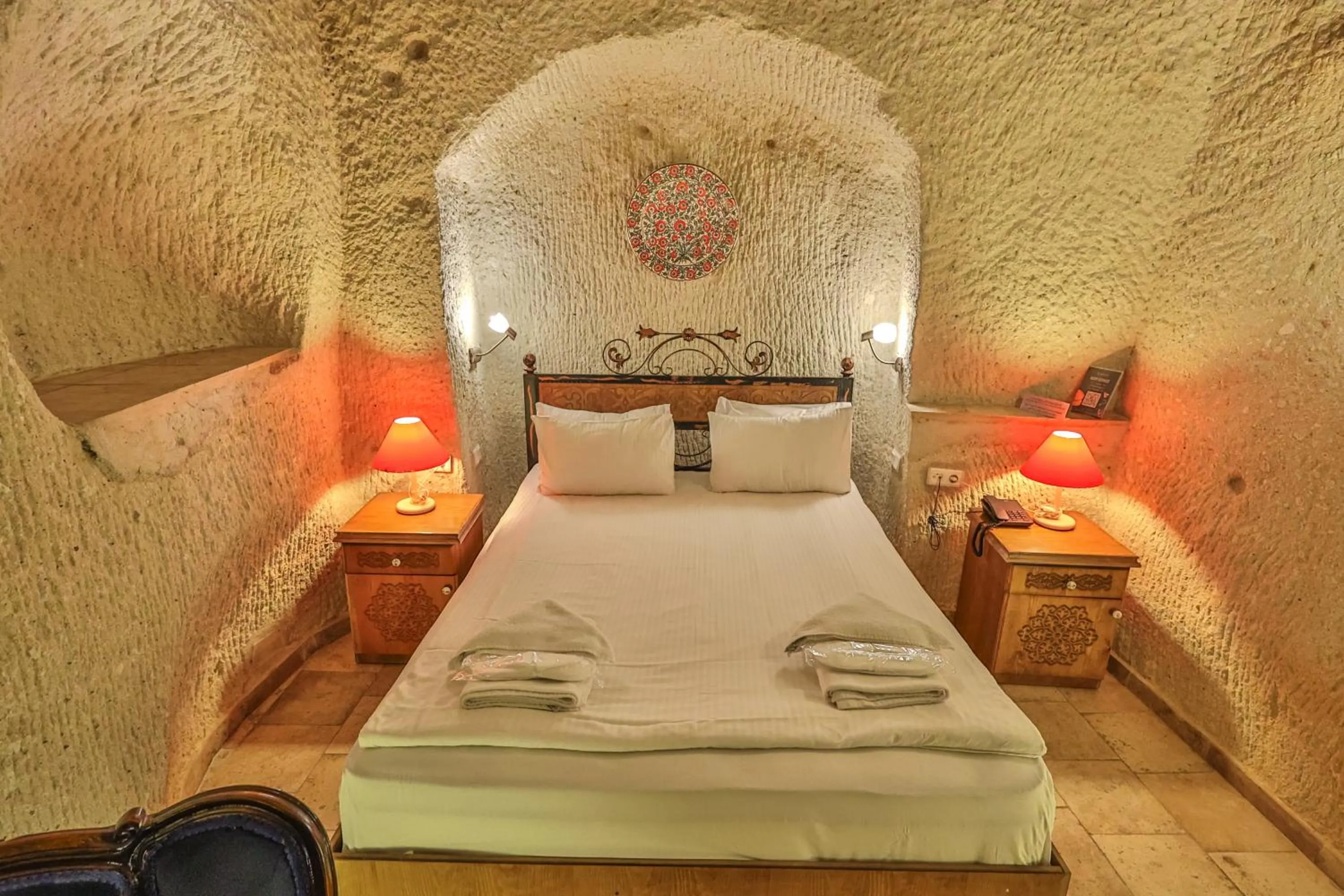 Bed in Bedrock Cave Hotel
