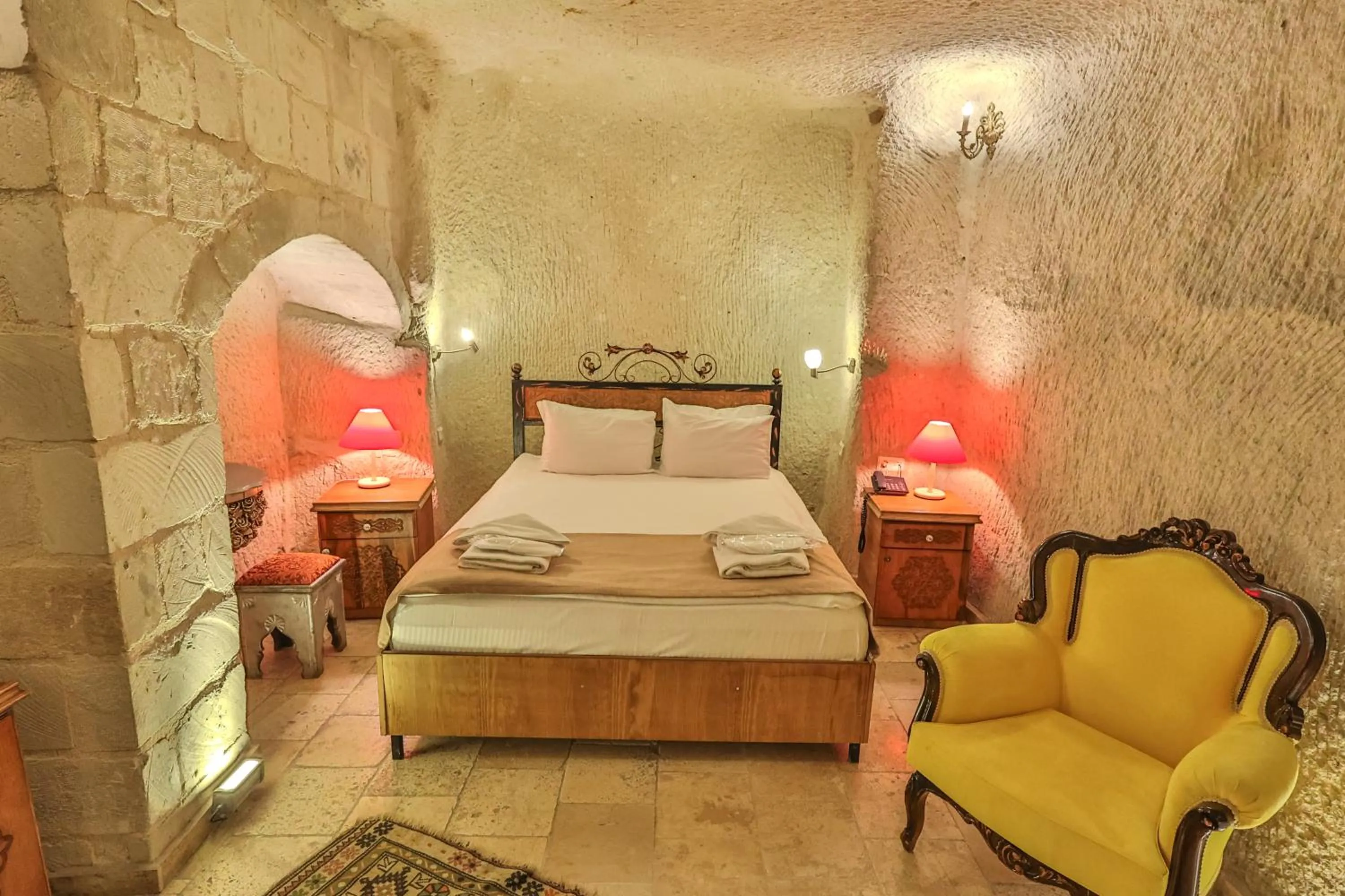 Bed in Bedrock Cave Hotel