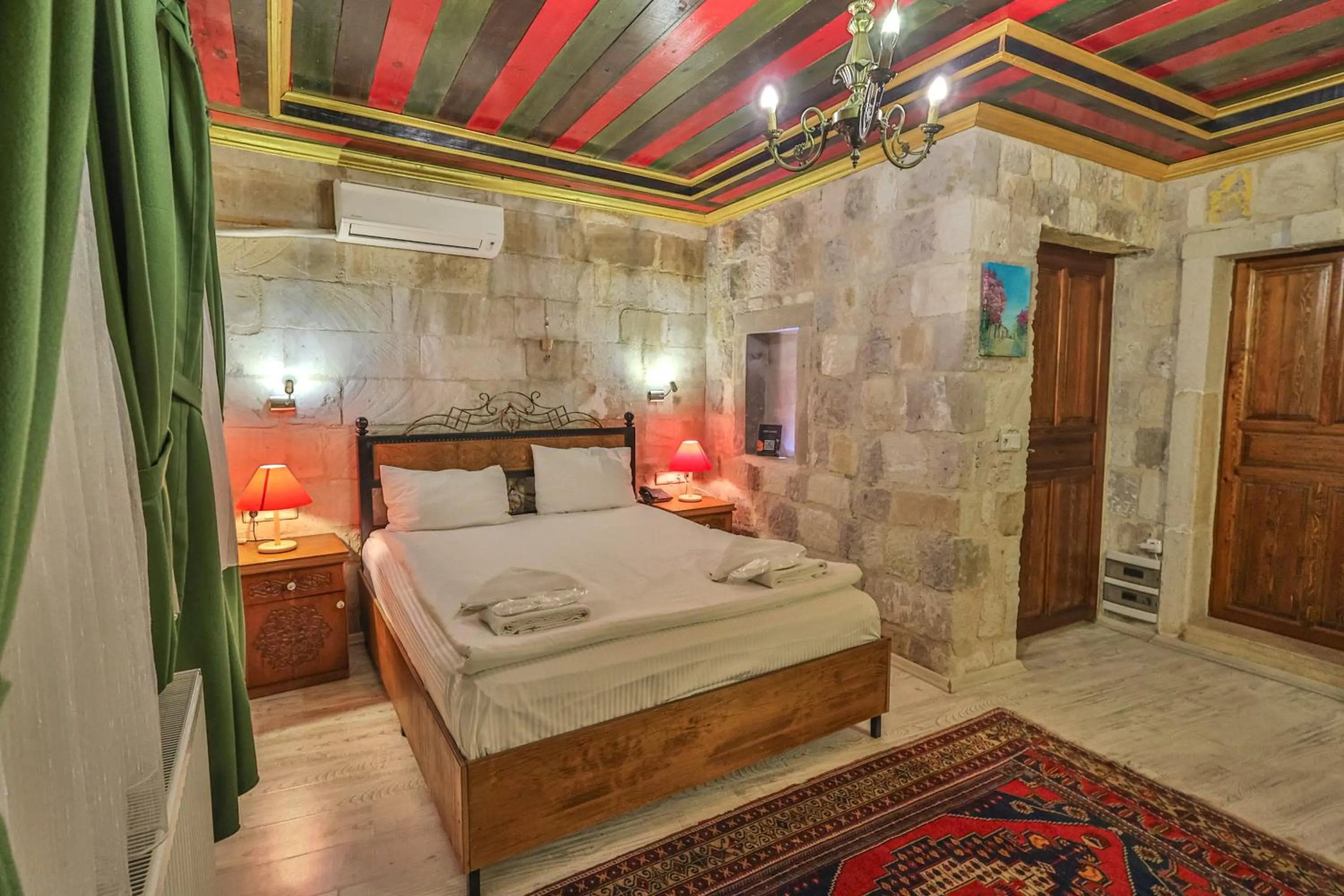 Bed in Bedrock Cave Hotel