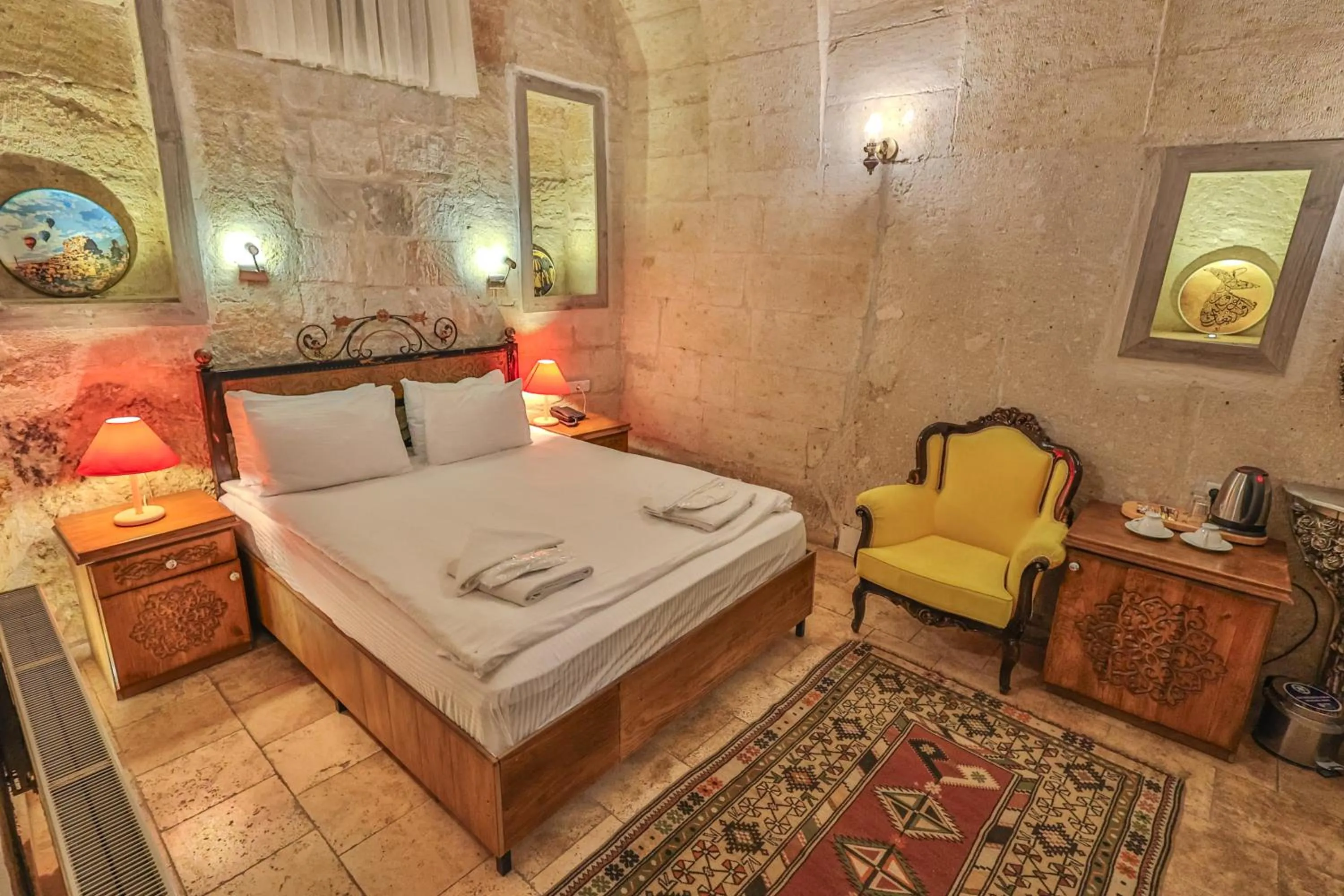 Bed in Bedrock Cave Hotel