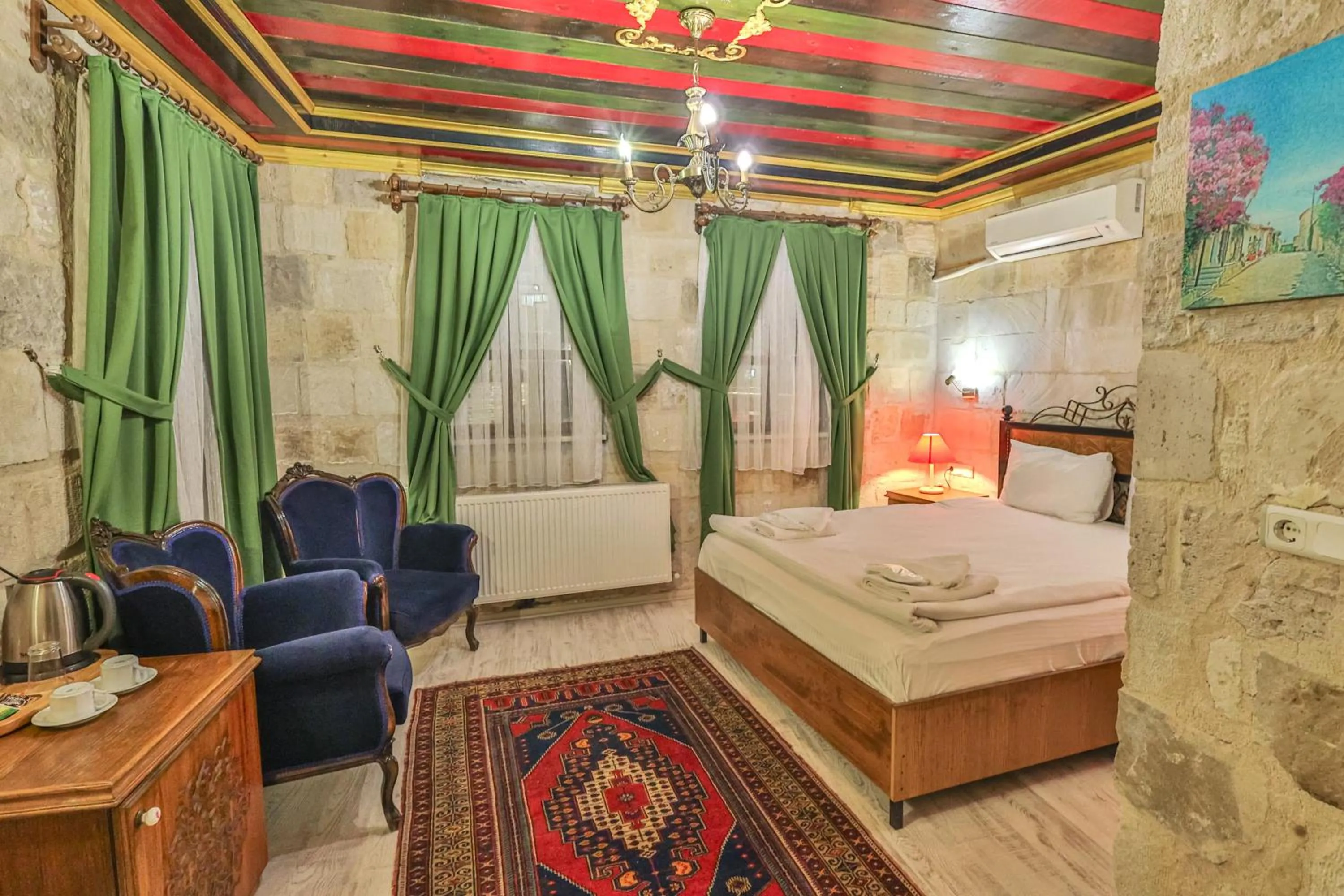 Bed in Bedrock Cave Hotel