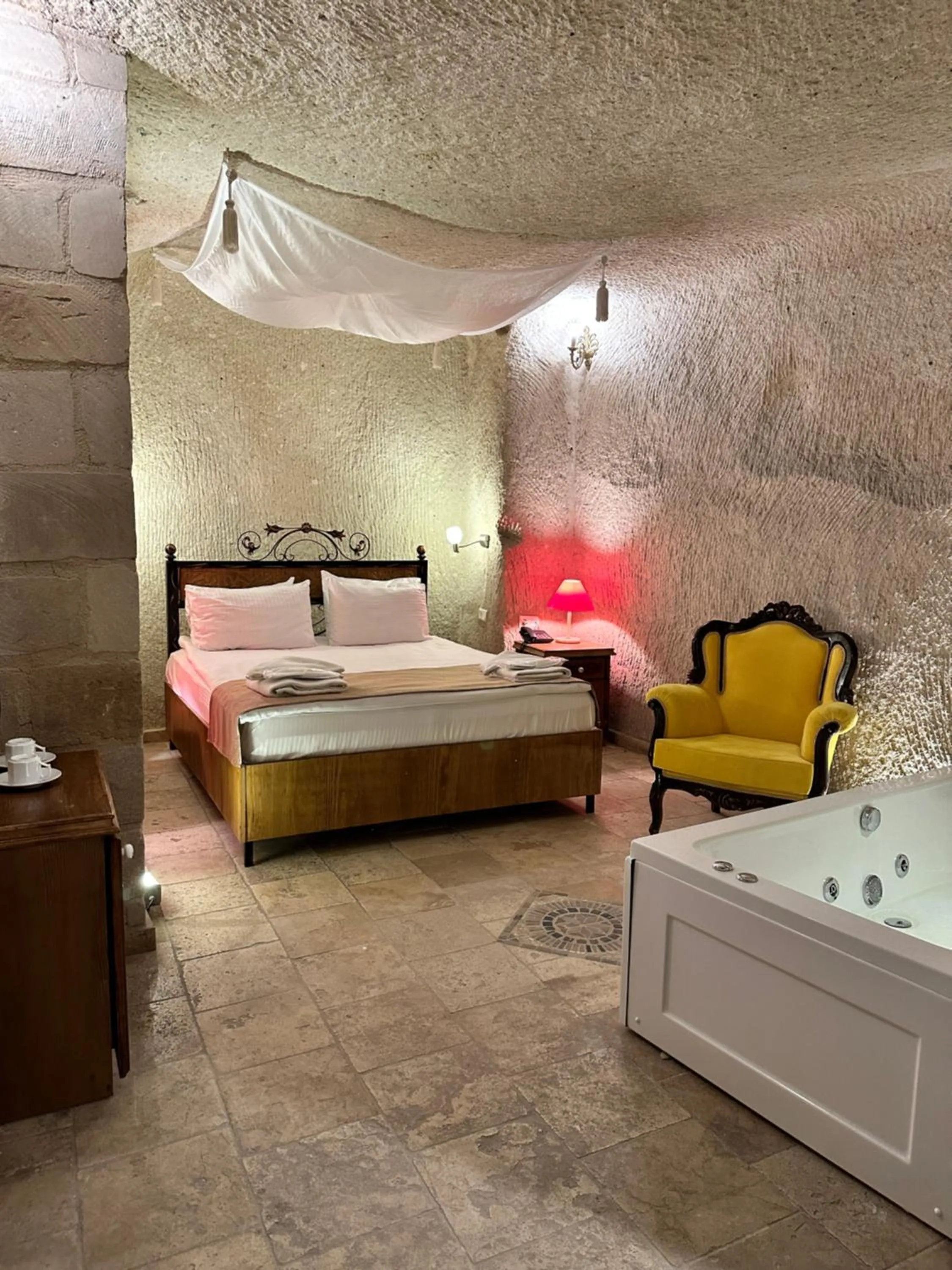 Bed in Bedrock Cave Hotel