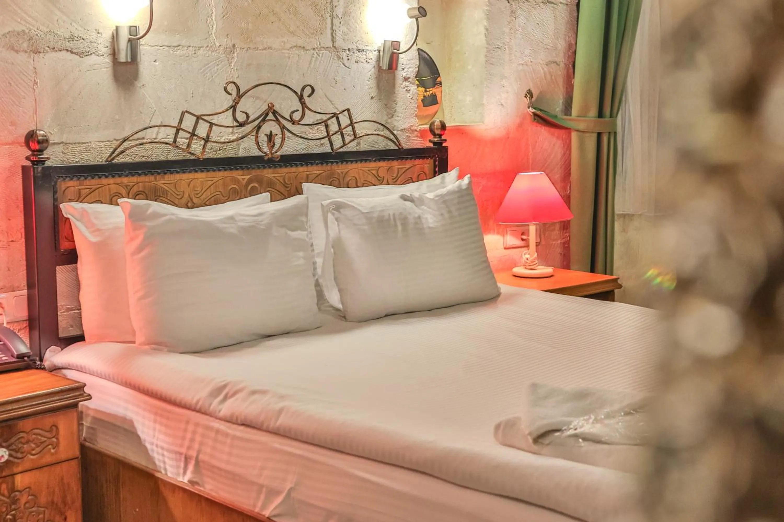 Bed in Bedrock Cave Hotel