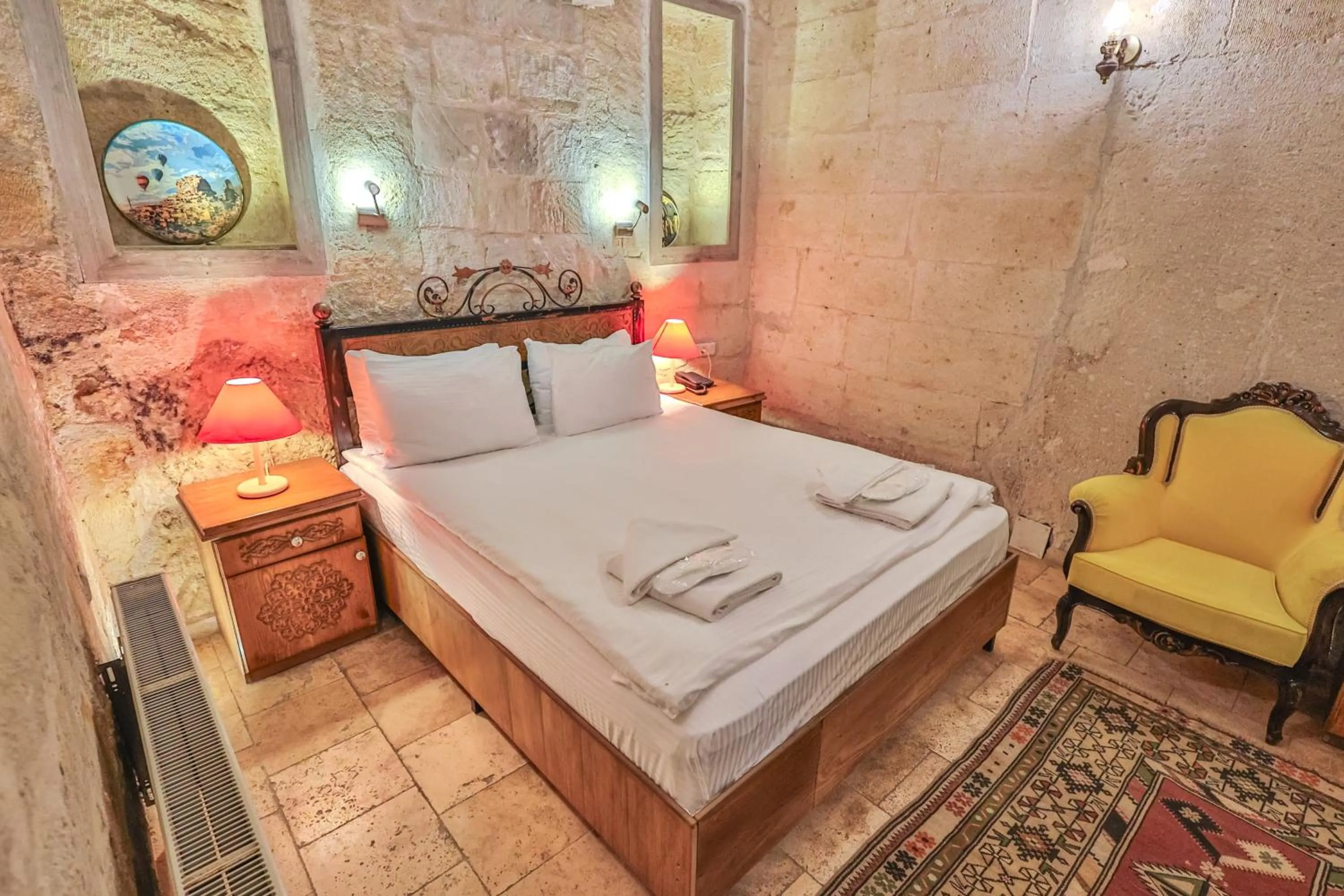 Bed in Bedrock Cave Hotel