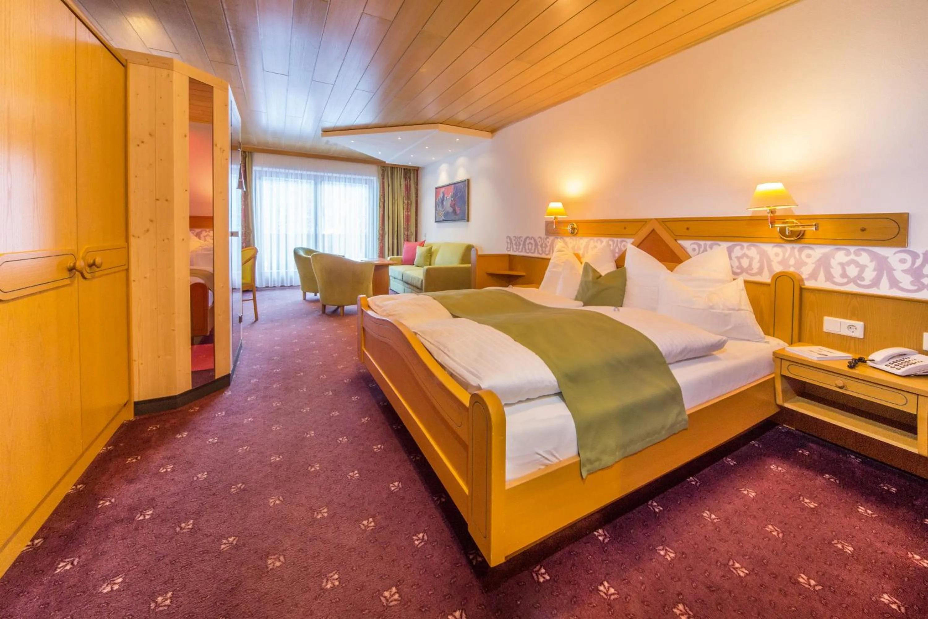 Photo of the whole room, Bed in Landhotel Alpenhof Filzmoos