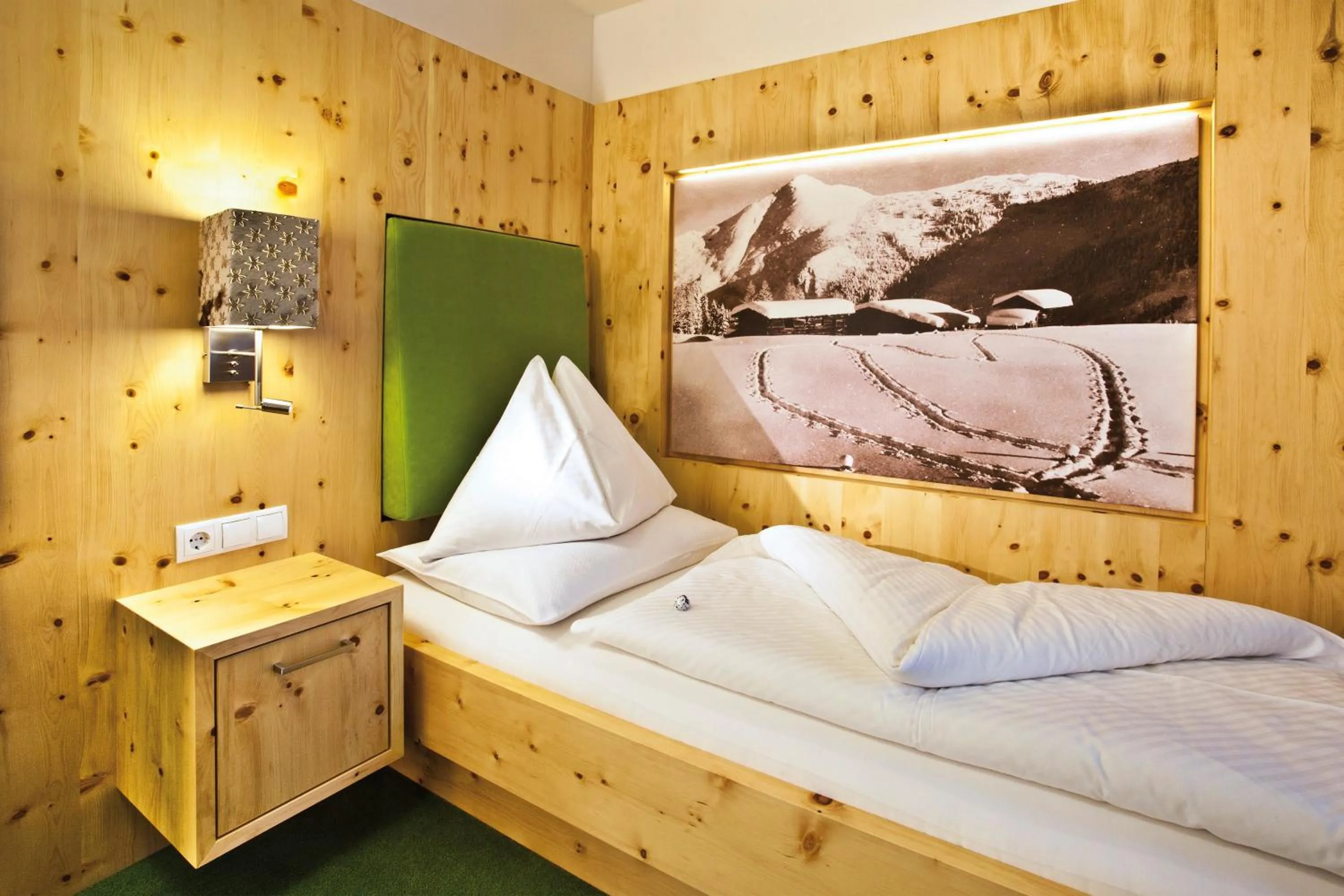 Photo of the whole room, Bed in Landhotel Alpenhof Filzmoos