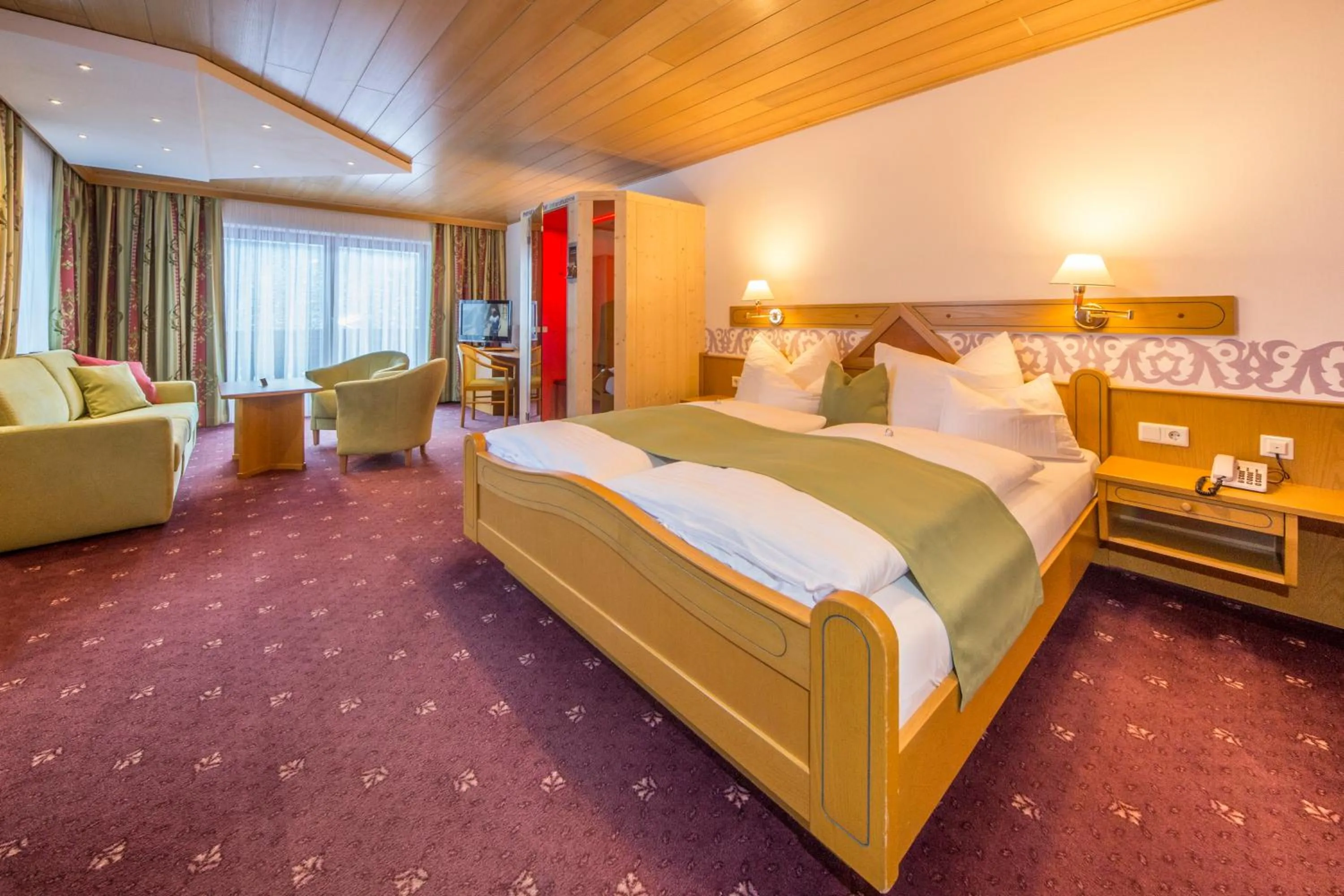 Photo of the whole room, Bed in Landhotel Alpenhof Filzmoos