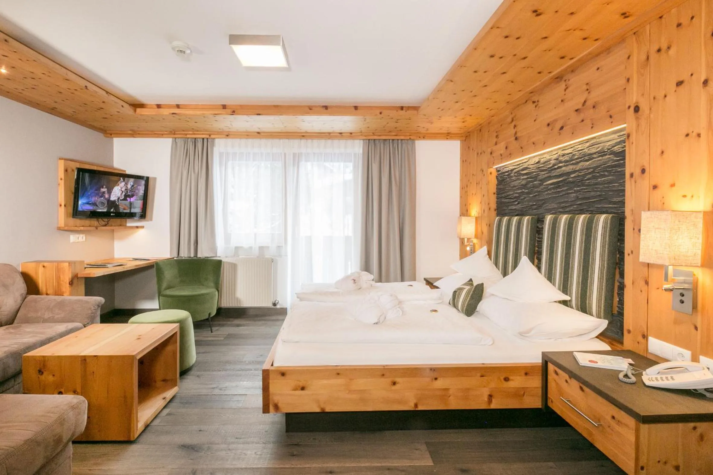 Photo of the whole room, Bed in Landhotel Alpenhof Filzmoos