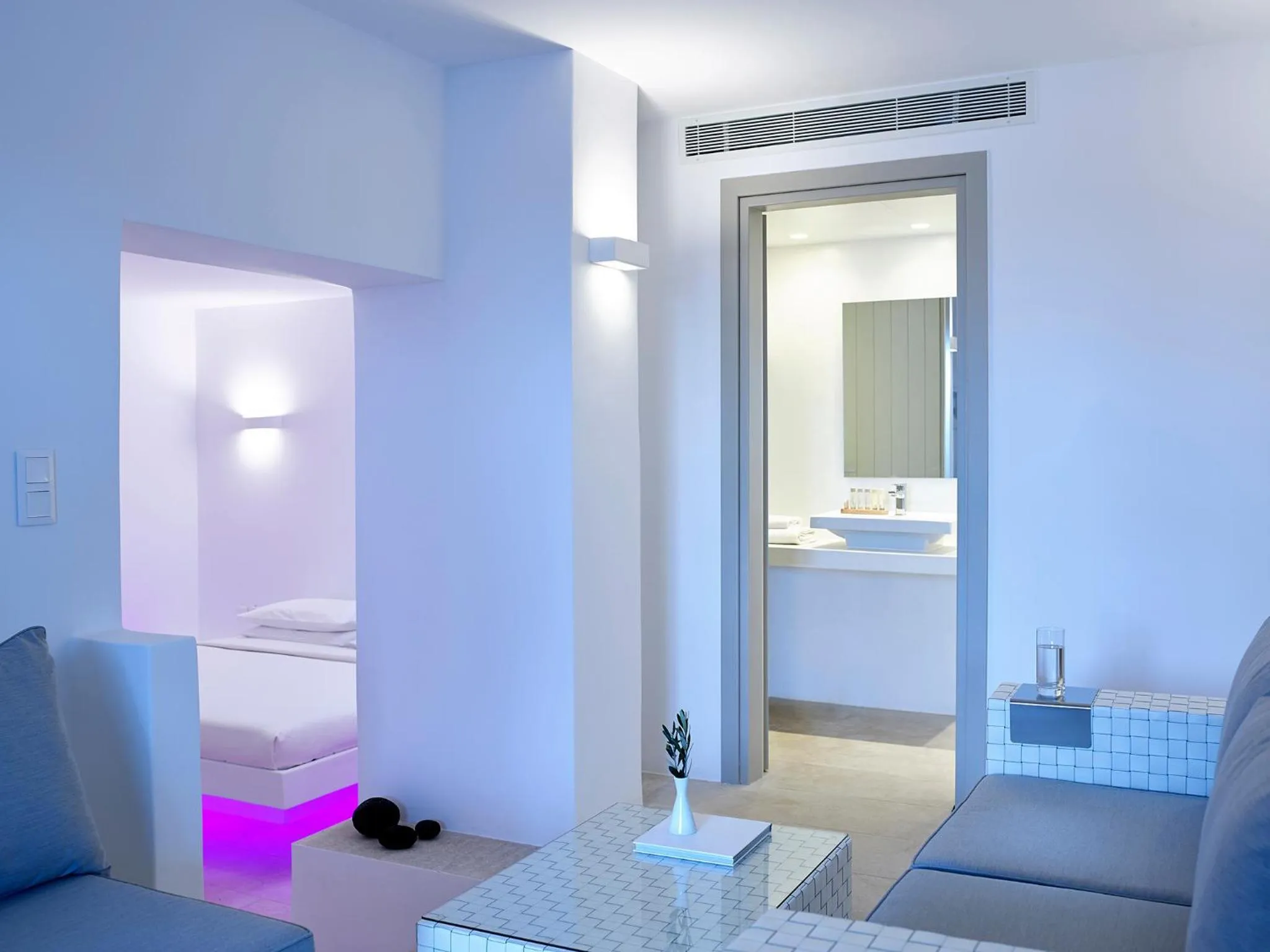 Seating area, Bed in Aurora Santorini