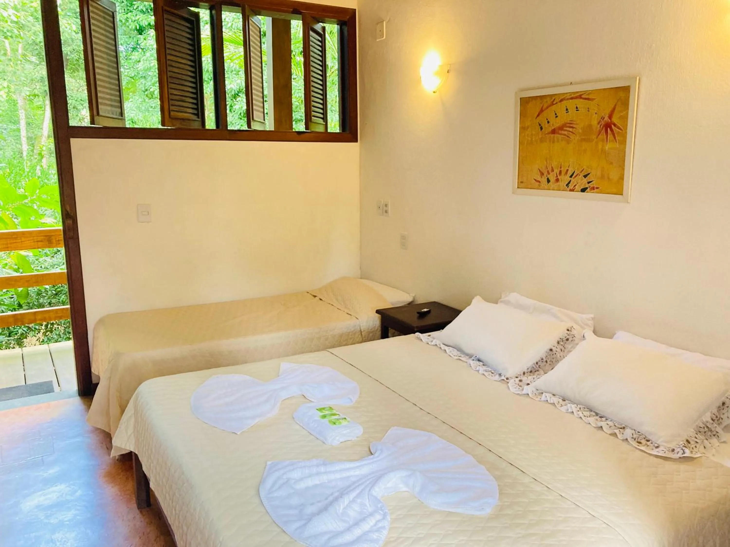 Bed in Pousada Rumo dos Ventos