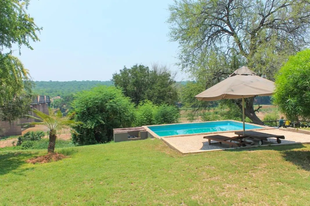 Swimming pool in Three Bridges B&B