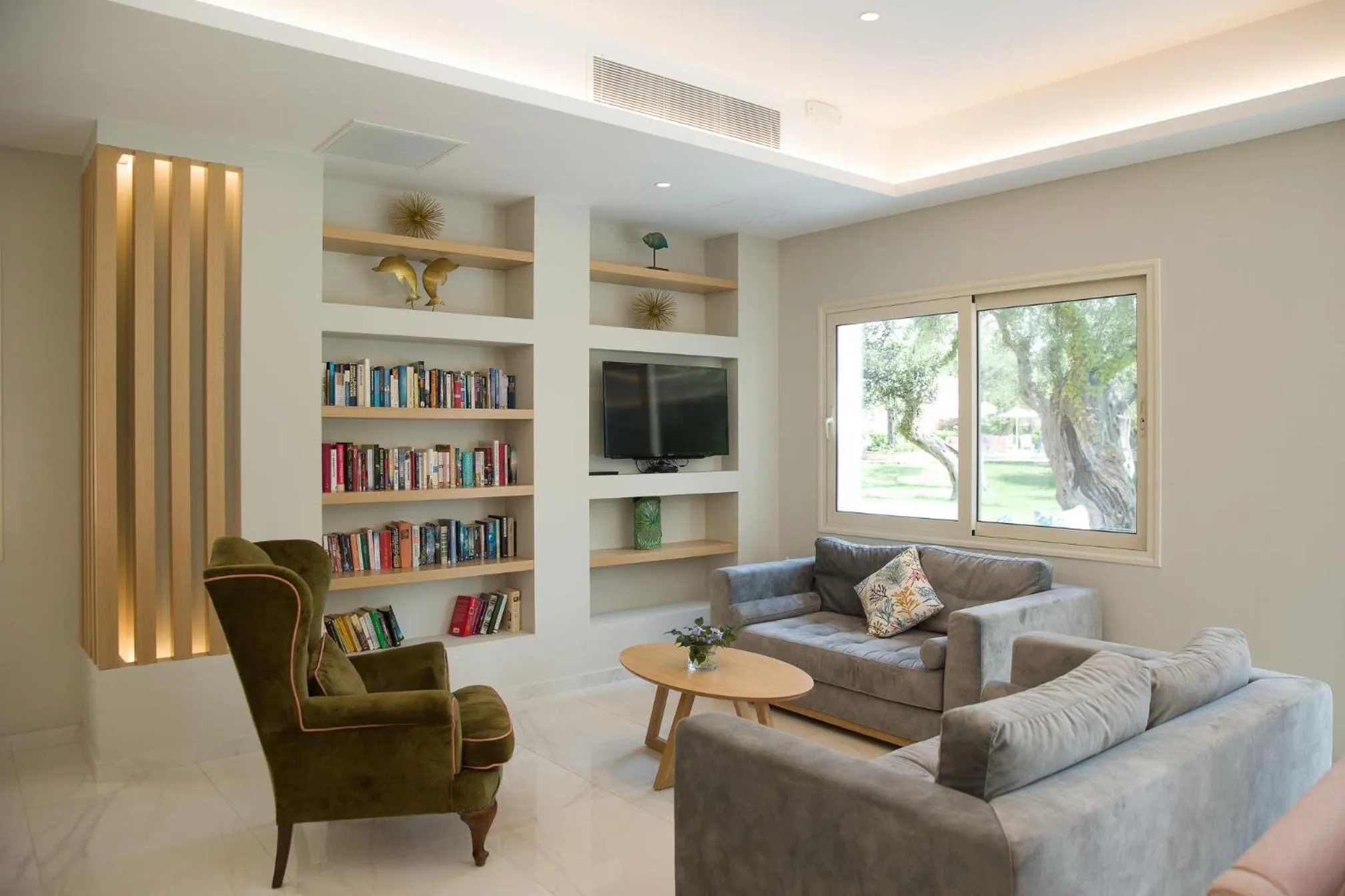 Communal lounge/ TV room in Delfinia Hotel