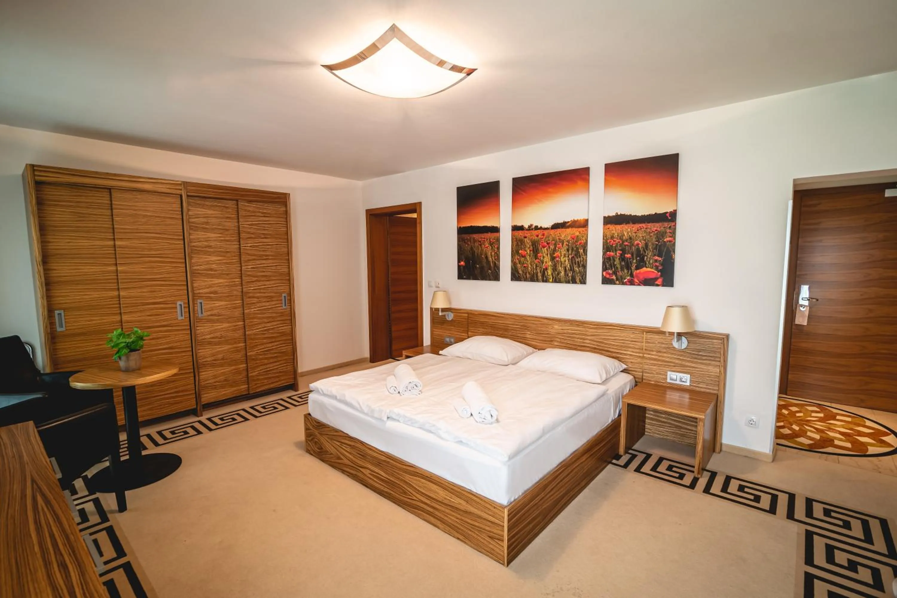 Seating area, Bed in Casino & Hotel ADMIRAL Kozina