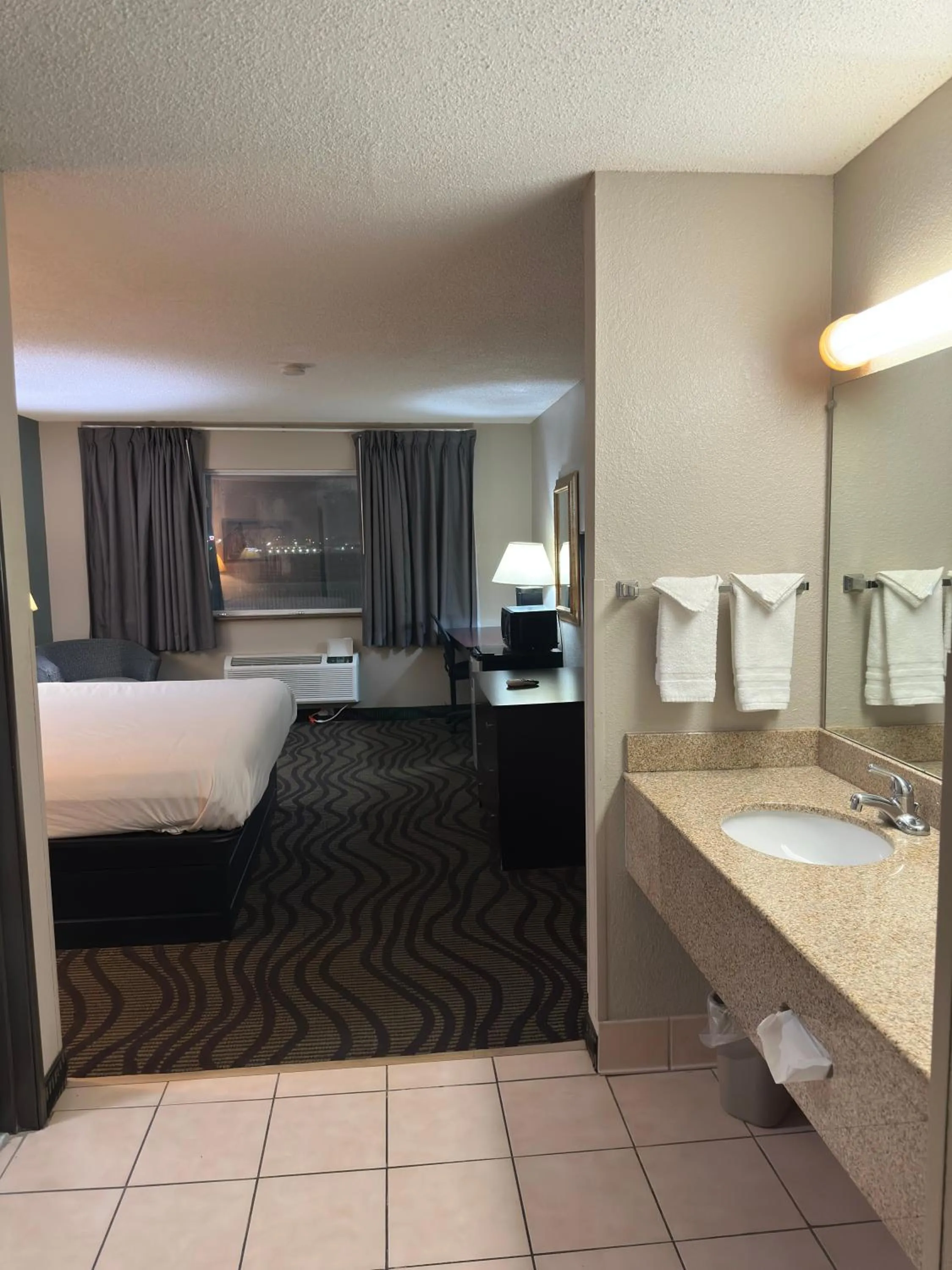 Bed in Baymont Inn & Suites by Wyndham Lincoln NE