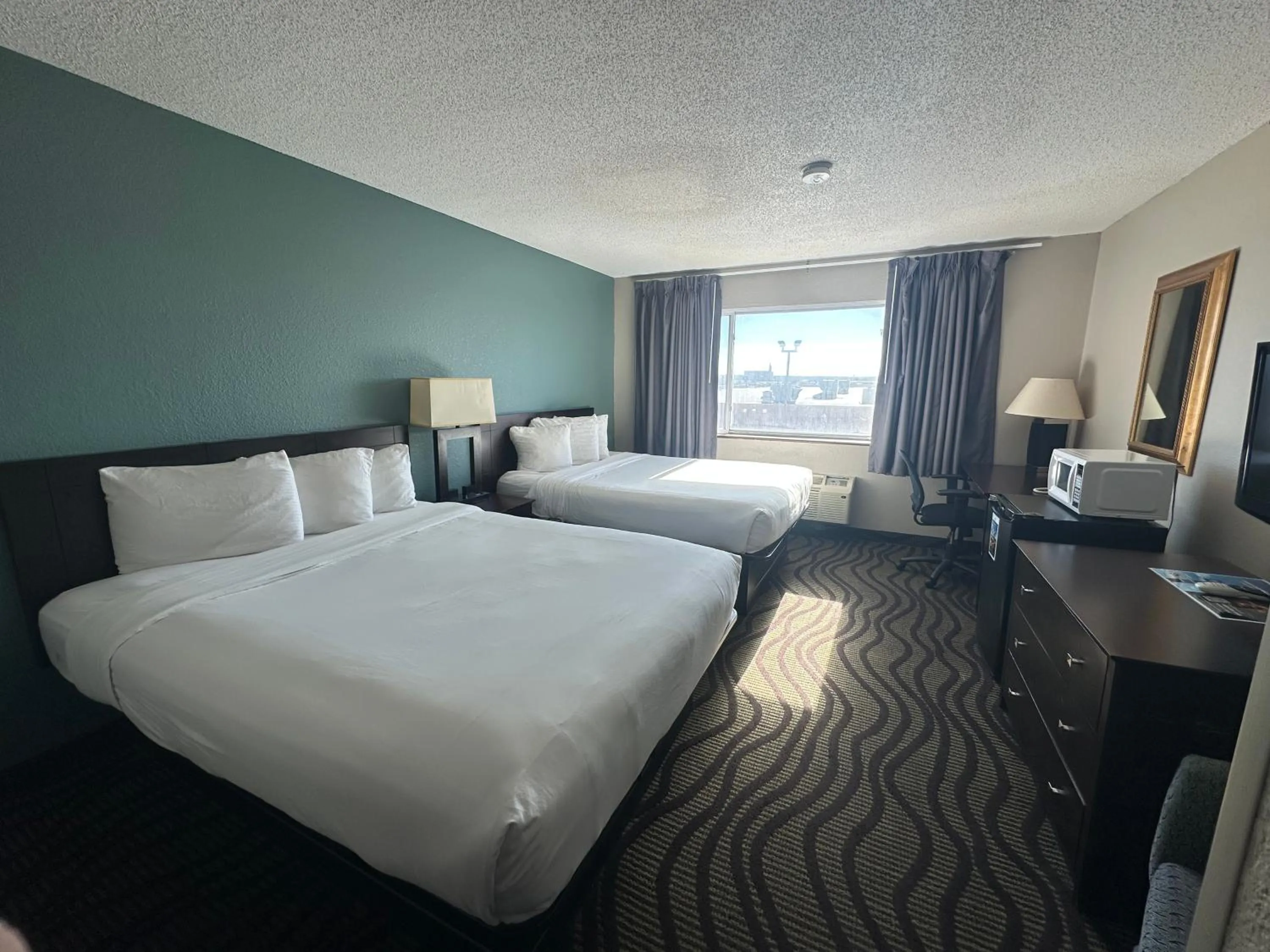 Bed in Baymont Inn & Suites by Wyndham Lincoln NE