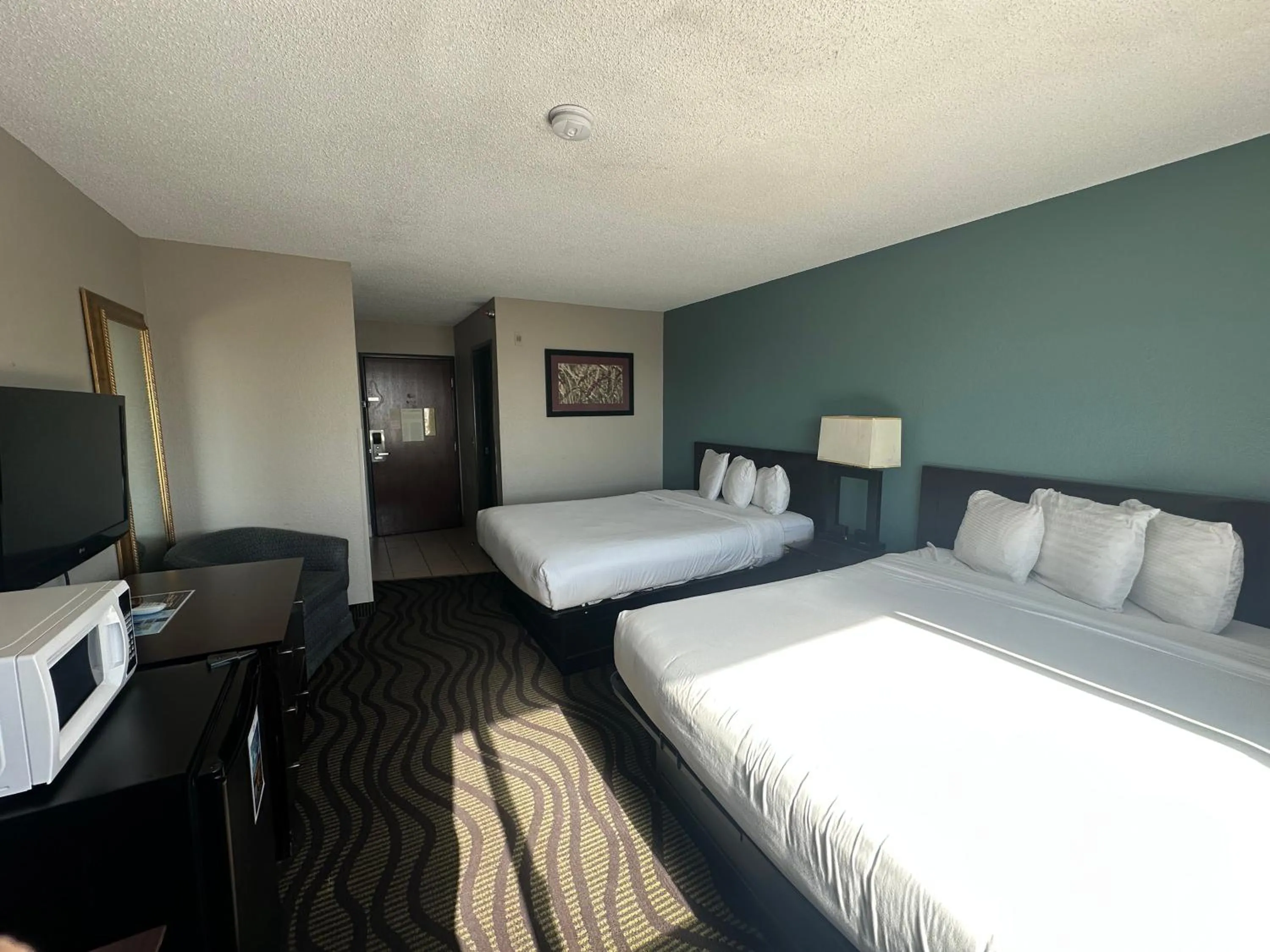 Bed in Baymont Inn & Suites by Wyndham Lincoln NE