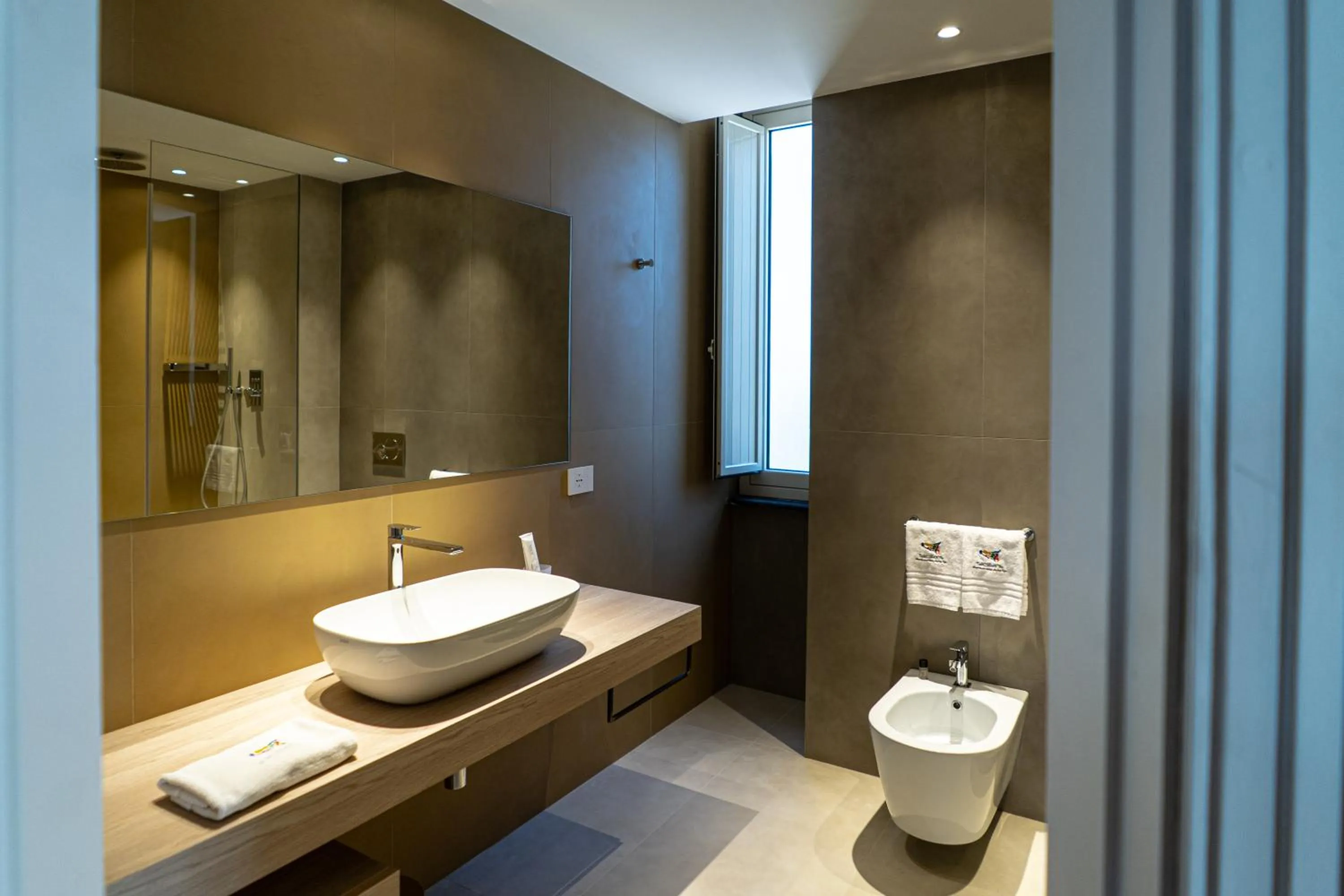 Toilet in Picciolo Etna Golf Resort & Spa, Curio Collection by Hilton