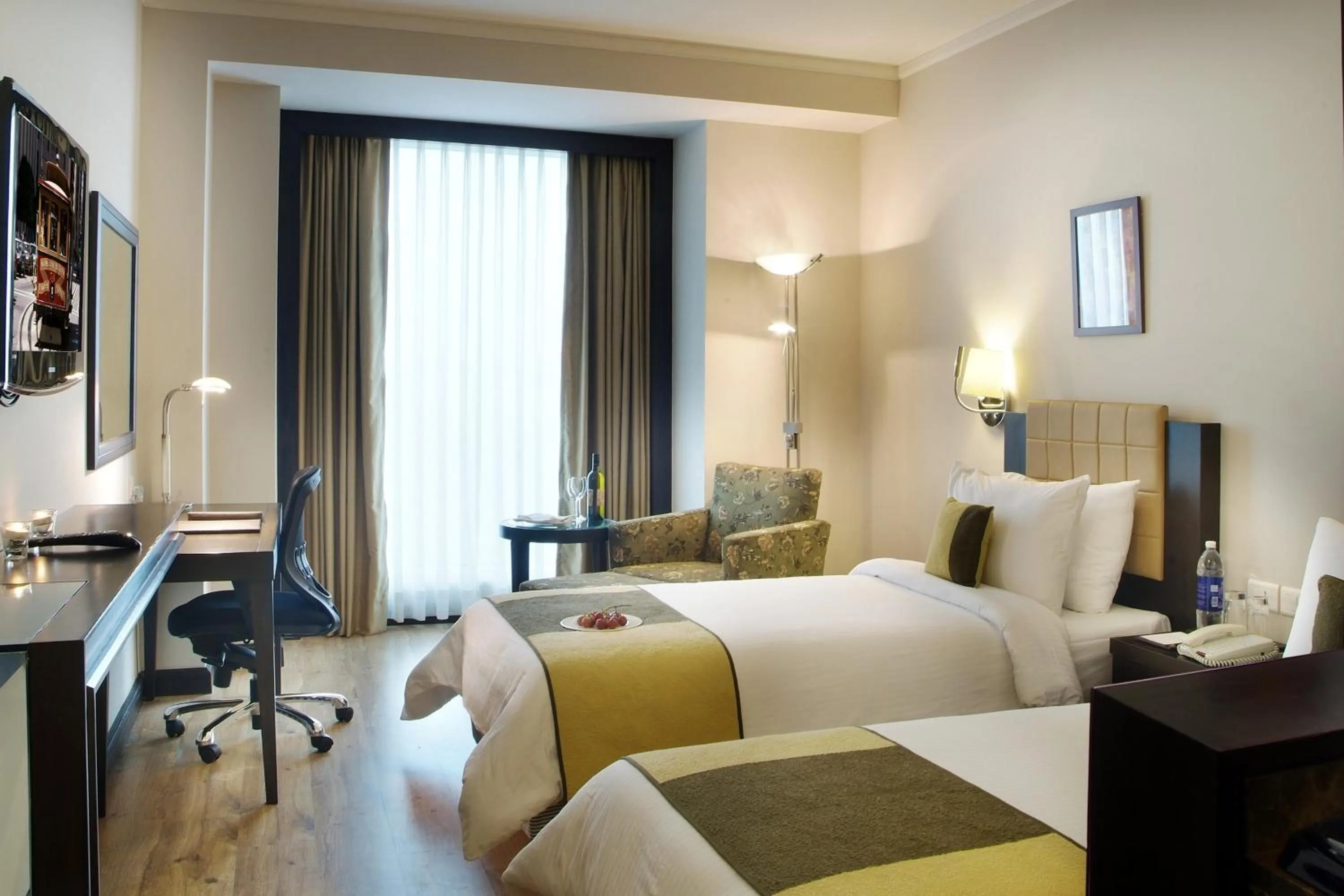 Photo of the whole room, Bed in Goldfinch Hotel Delhi NCR