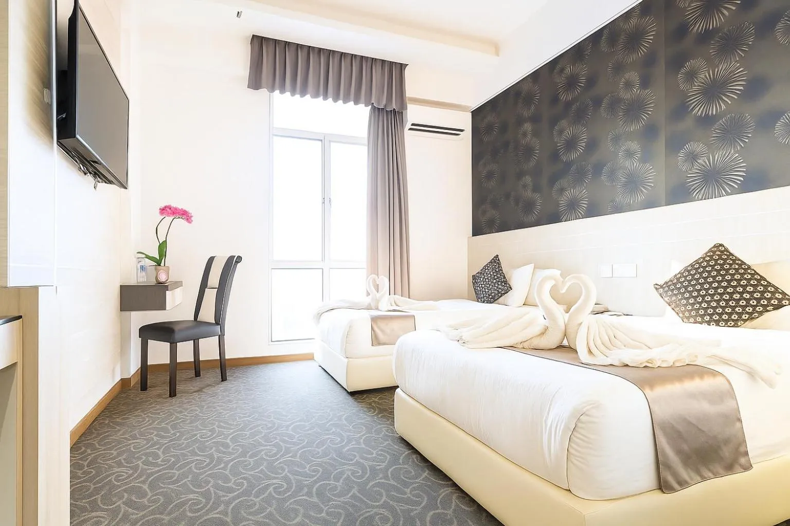 Bed in THE REED HOTEL MELAKA formerly known as E-Red Hotel Melaka