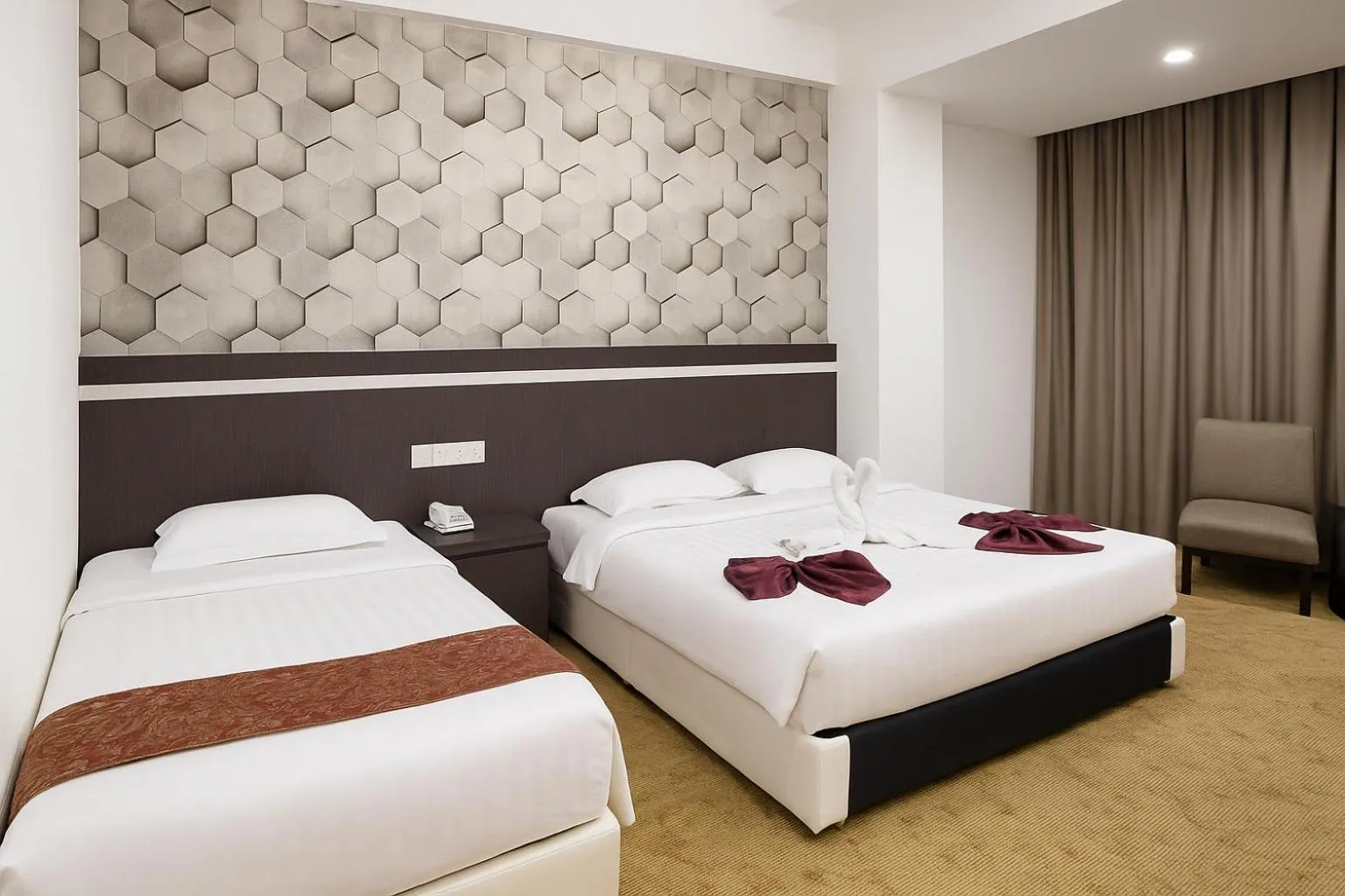 Bed in THE REED HOTEL MELAKA formerly known as E-Red Hotel Melaka