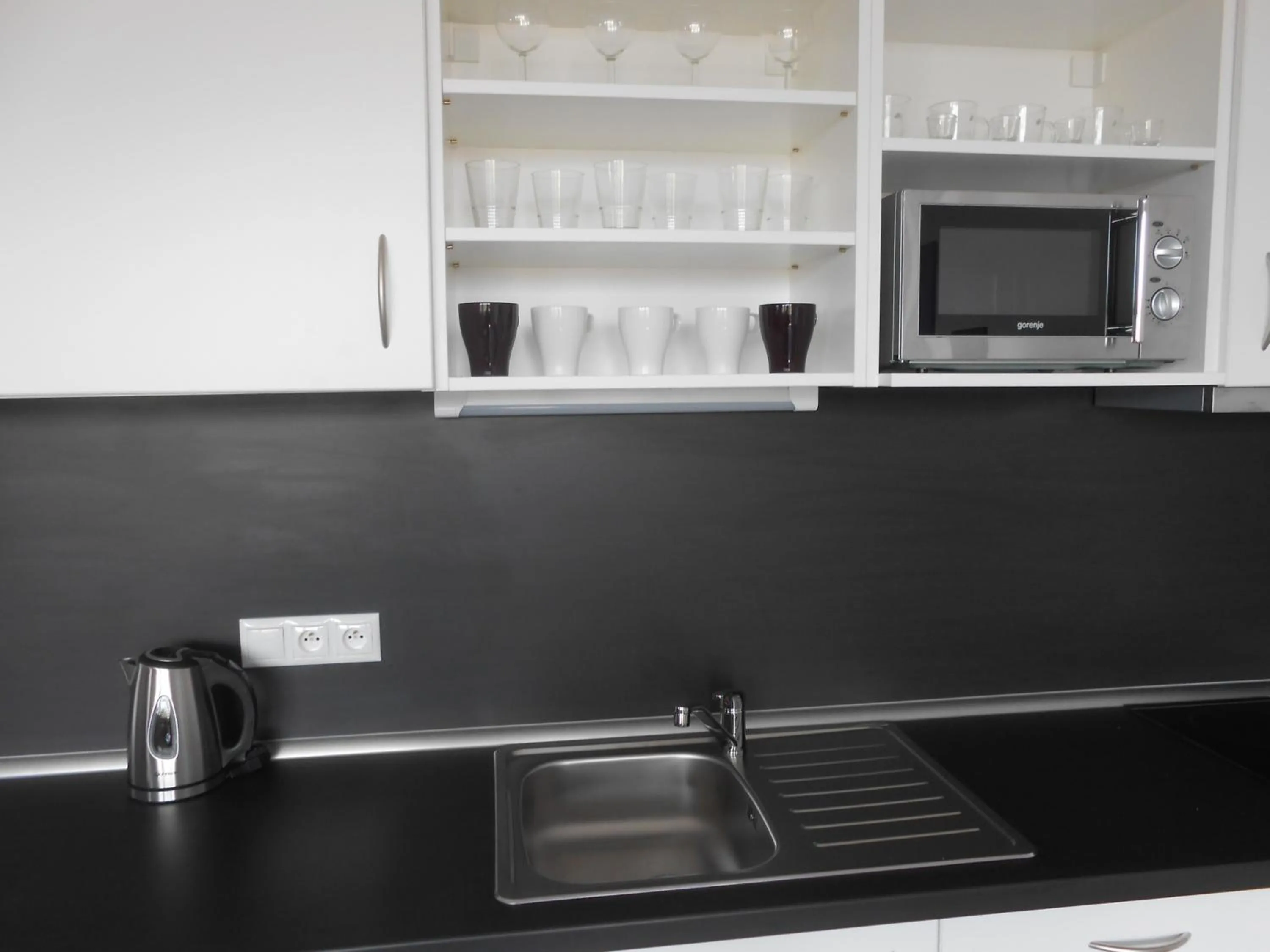 Kitchen or kitchenette in Apartments 4U center + free parking