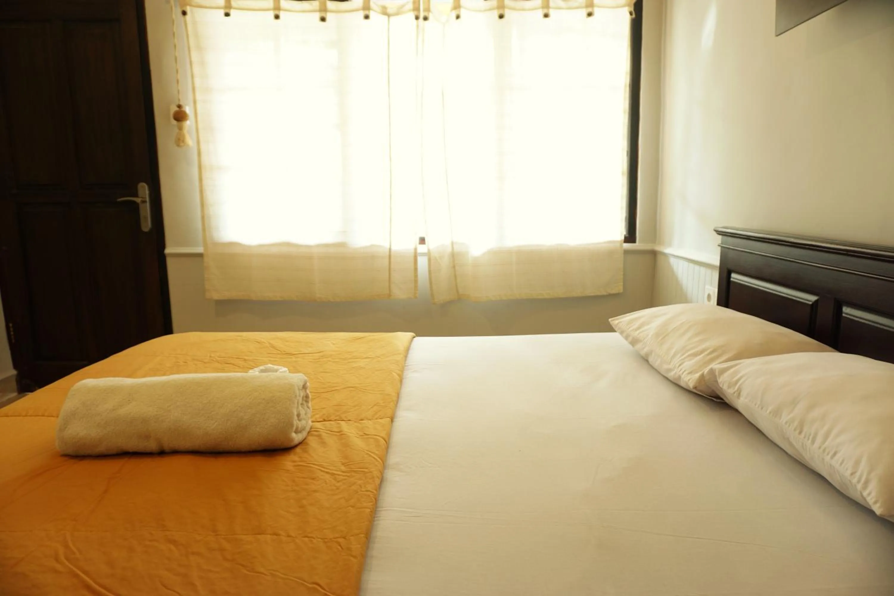 Bed in Sari Indah Cottages